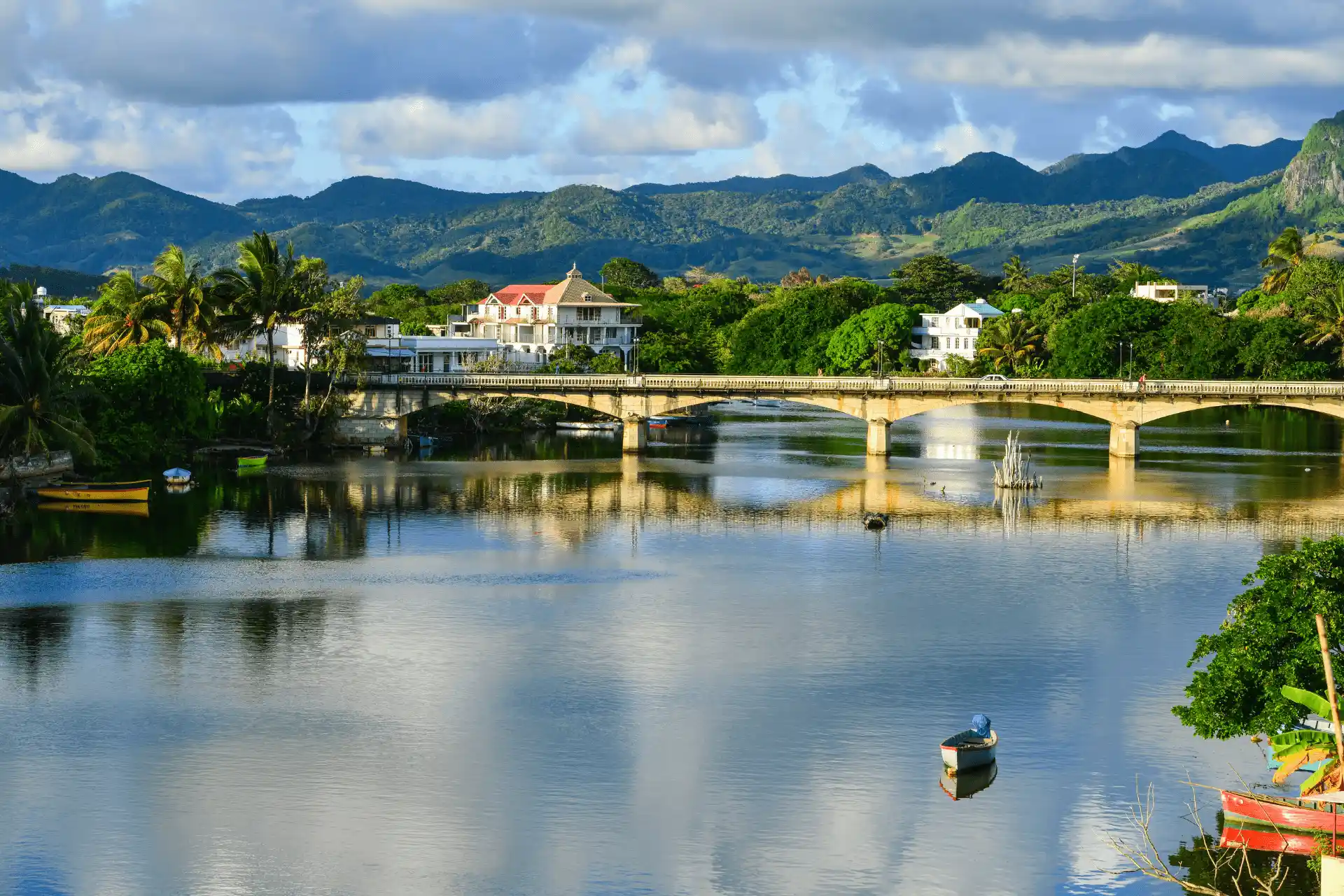 mahebourg mauritius coastal town with colorful buildings bustling streets traditional fishing boats and clear blue waters along the shoreline