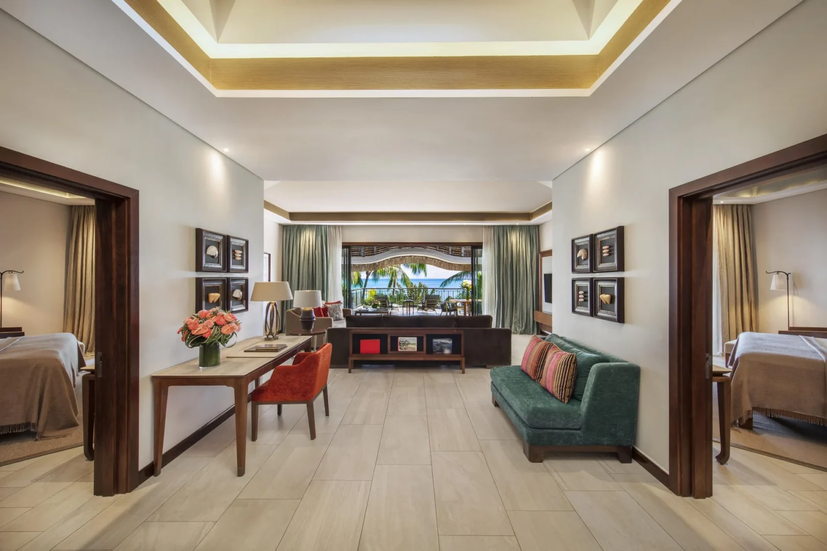 royal palm presidential suite hallway with elegant decor, lighting, and access to rooms