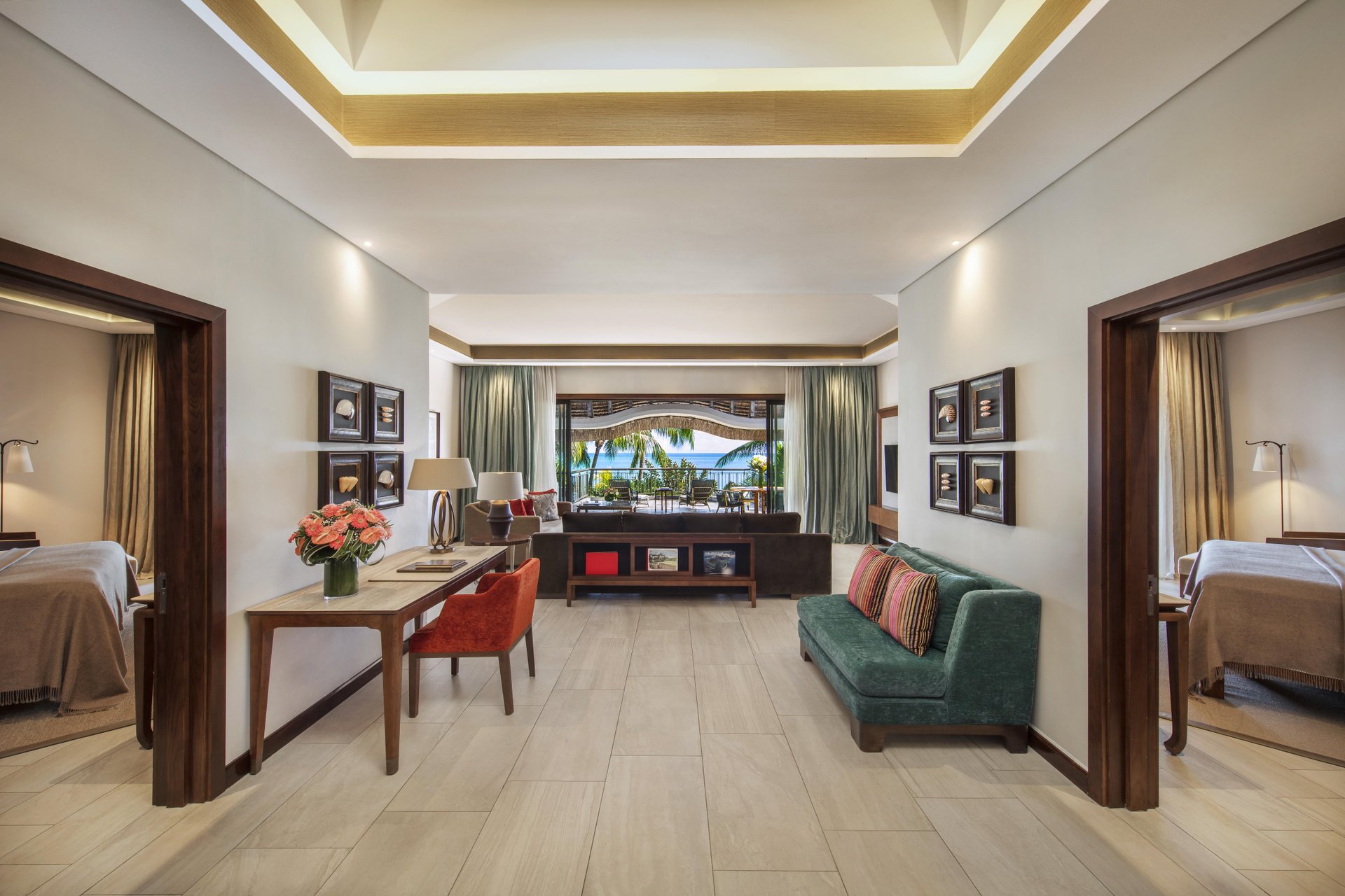 royal palm presidential suite hallway with elegant decor, lighting, and access to rooms