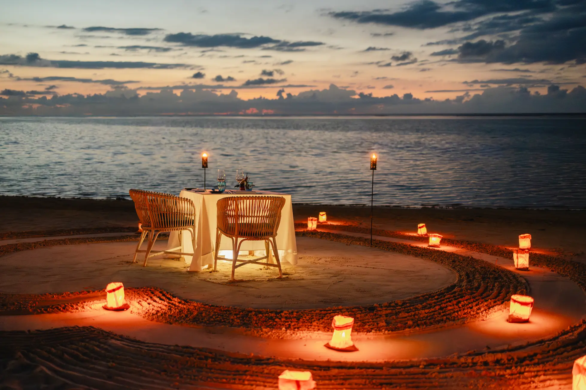 trou aux biches beachcomber mauritius intimate dine under the stars beachfront dinner setting with candles and ocean views