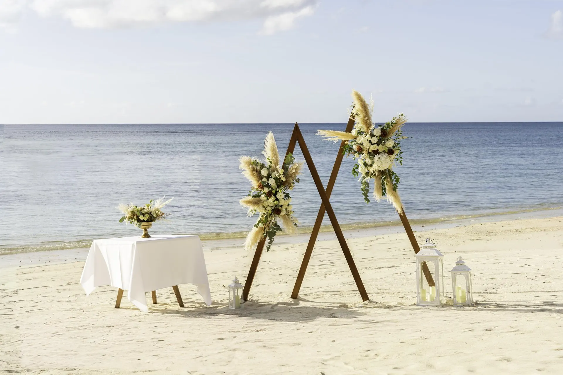 victoria mauritius wedding setup on beachfront with floral arch and ocean view