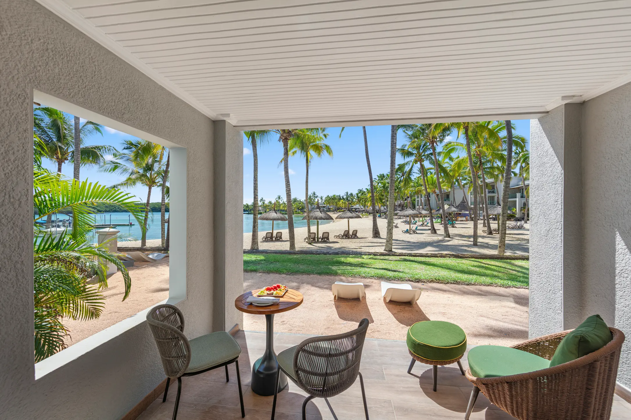 Private terrace view from a Beach Room at Shandrani Beachcomber Mauritius overlooking the resort gardens and coastal surroundings