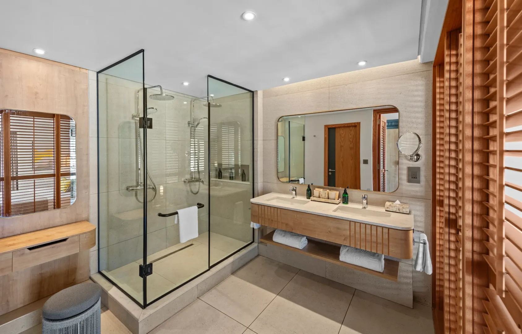 Walk-in shower in a Beach Room at Shandrani Beachcomber Mauritius featuring modern fittings and a contemporary bathroom design