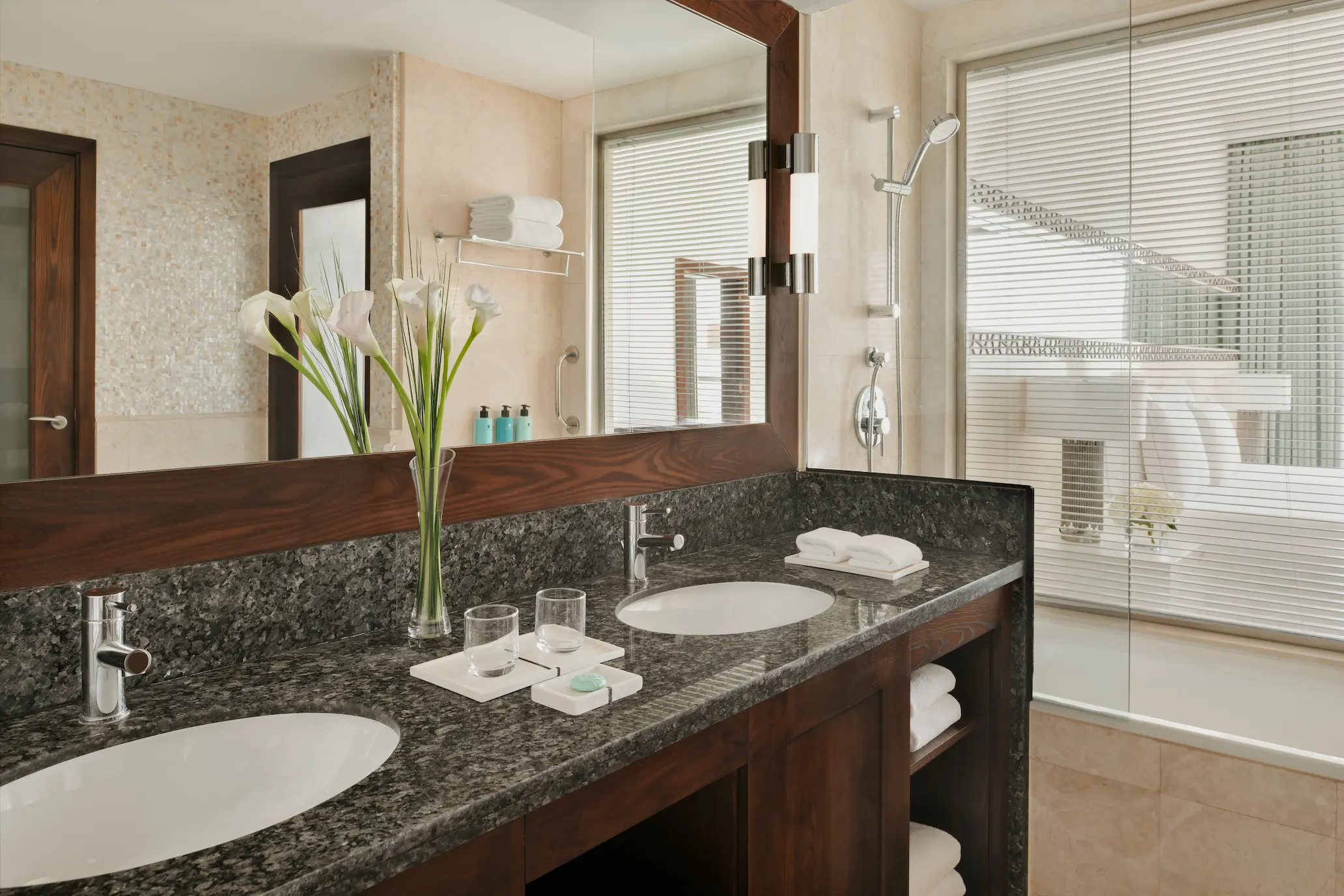 ain dubai view one bedroom family suite bathroom at ja ocean view hotel with ensuite tub and modern fixtures