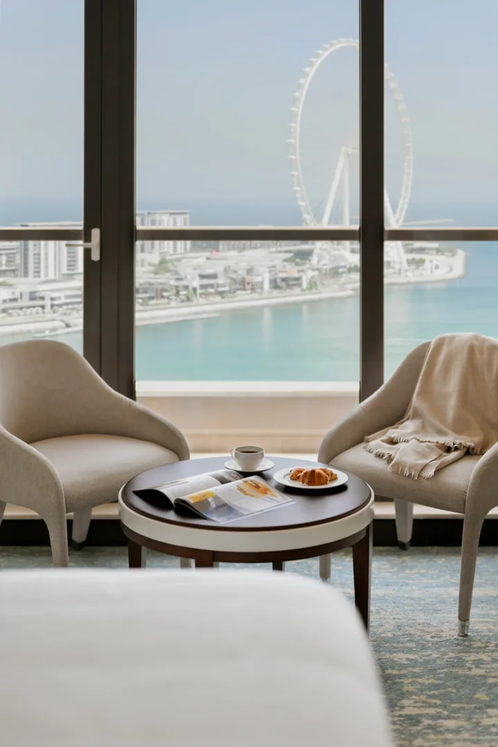 ain dubai view one bedroom family suite at ja ocean view hotel with lounge chairs
