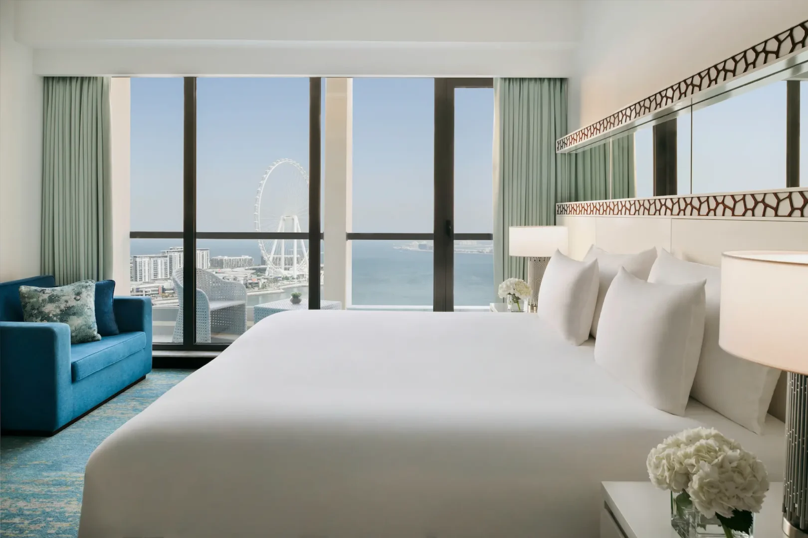 ain dubai view room at ja ocean view hotel with floor-to-ceiling windows and city views