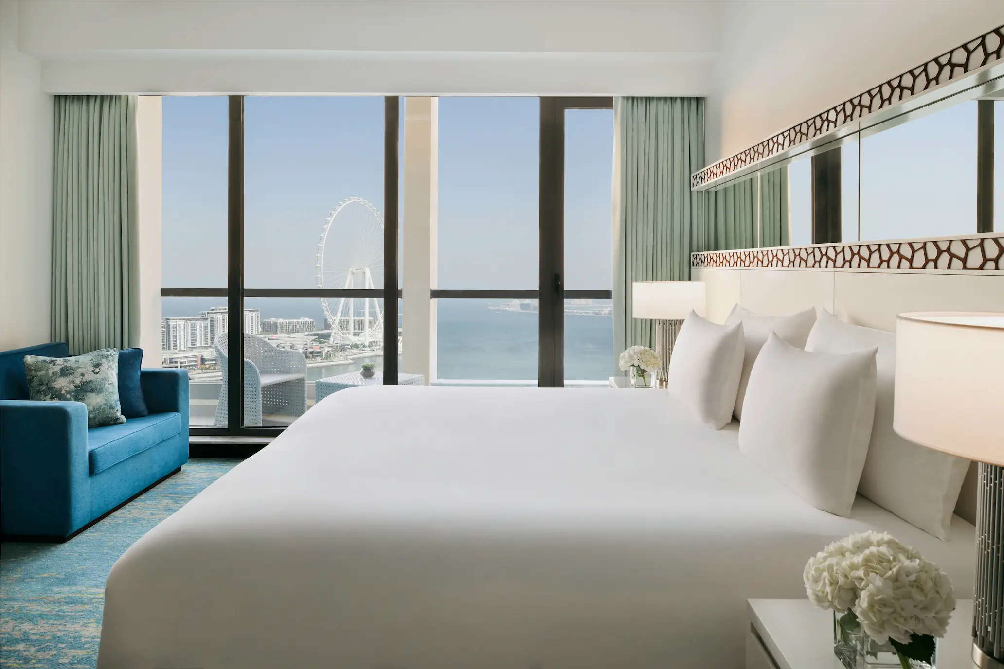 ain dubai view room at ja ocean view hotel with floor-to-ceiling windows and city views