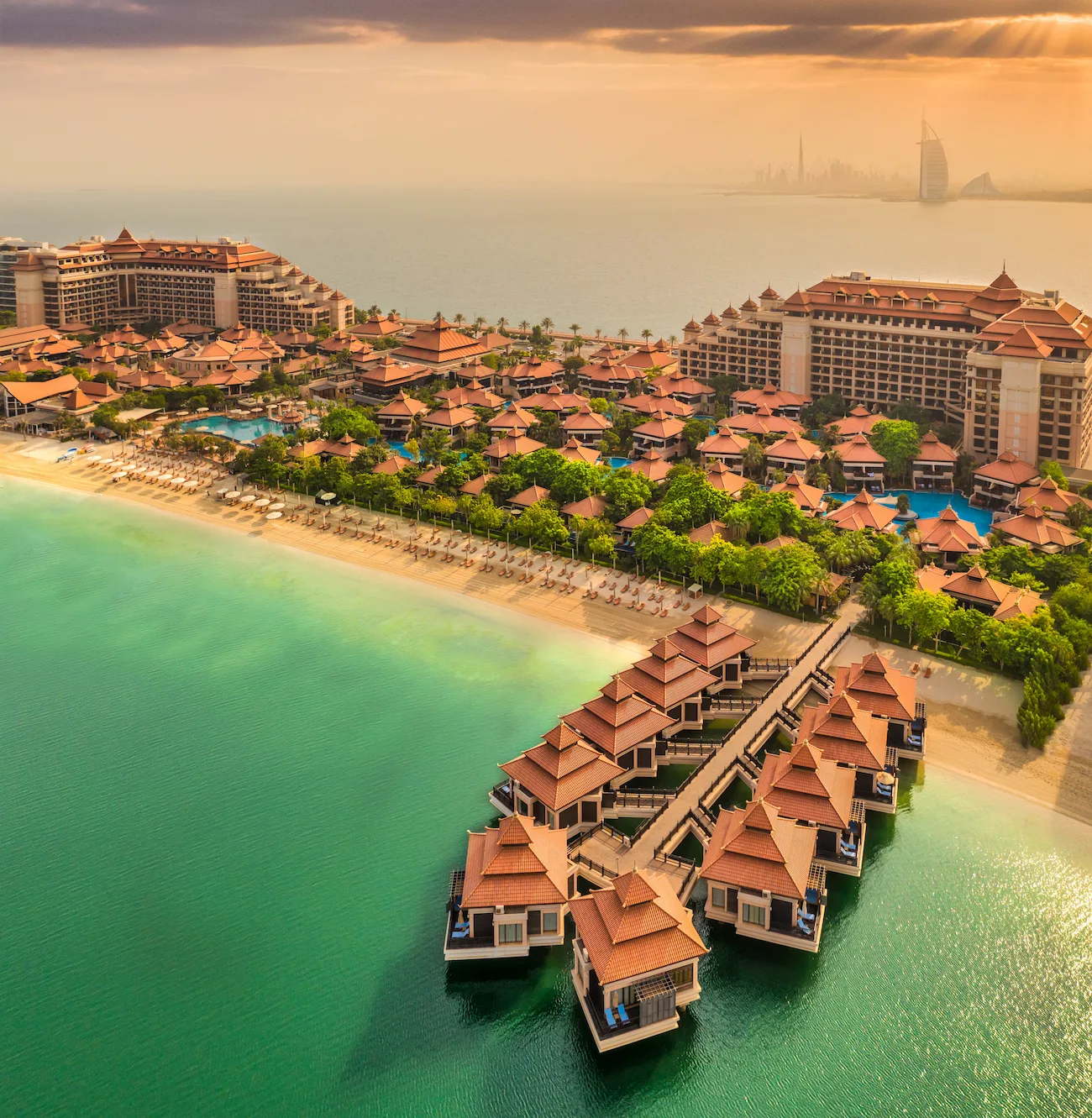 Here’s an SEO-friendly alt tag for that image: “Exterior view of Anantara The Palm Dubai Resort showcasing its beachfront setting and luxury design