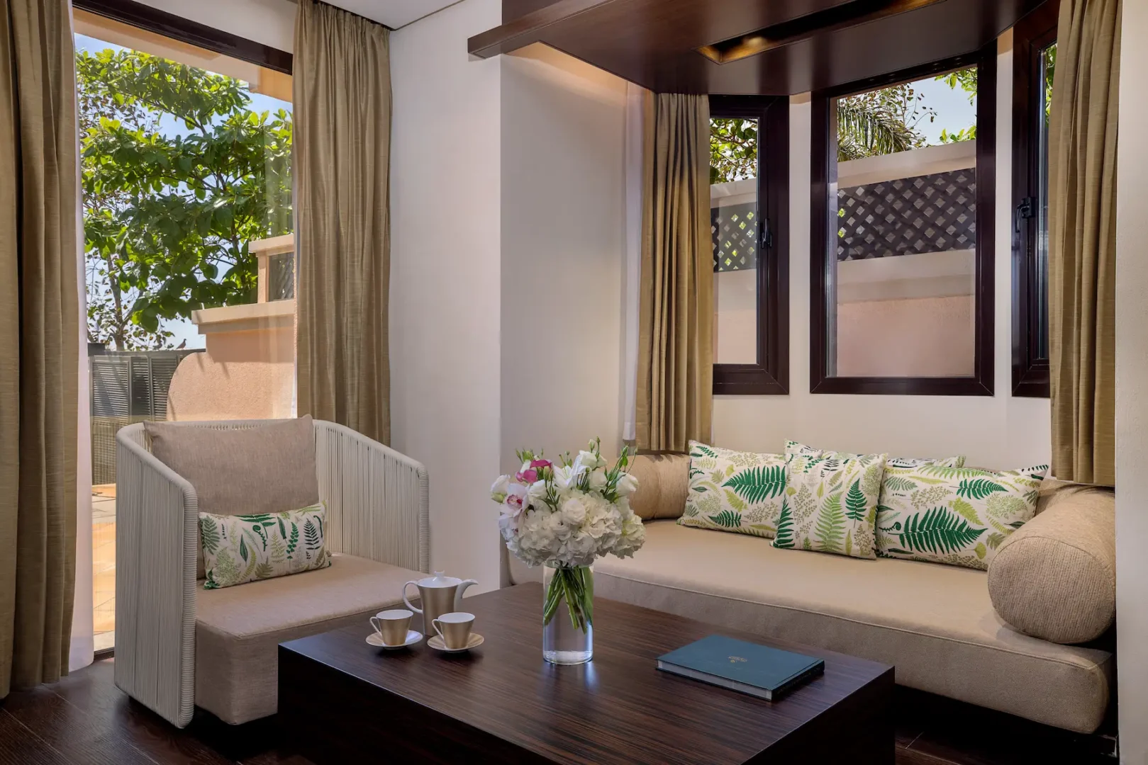 sofa area in one bedroom beach pool villa at anantara the palm dubai resort