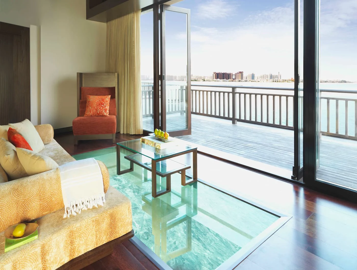 one bedroom overwater villa lounge at anantara the palm dubai resort overlooking palm jumeirah waters