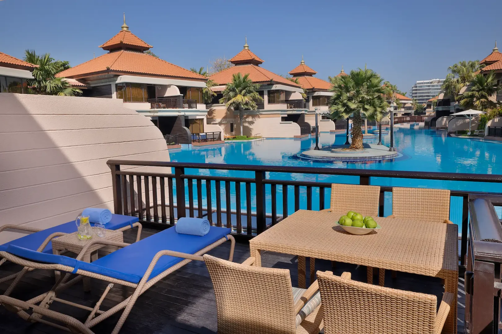 Deluxe Family Lagoon Access Room balcony at Anantara The Palm Dubai with seating area and lagoon views
