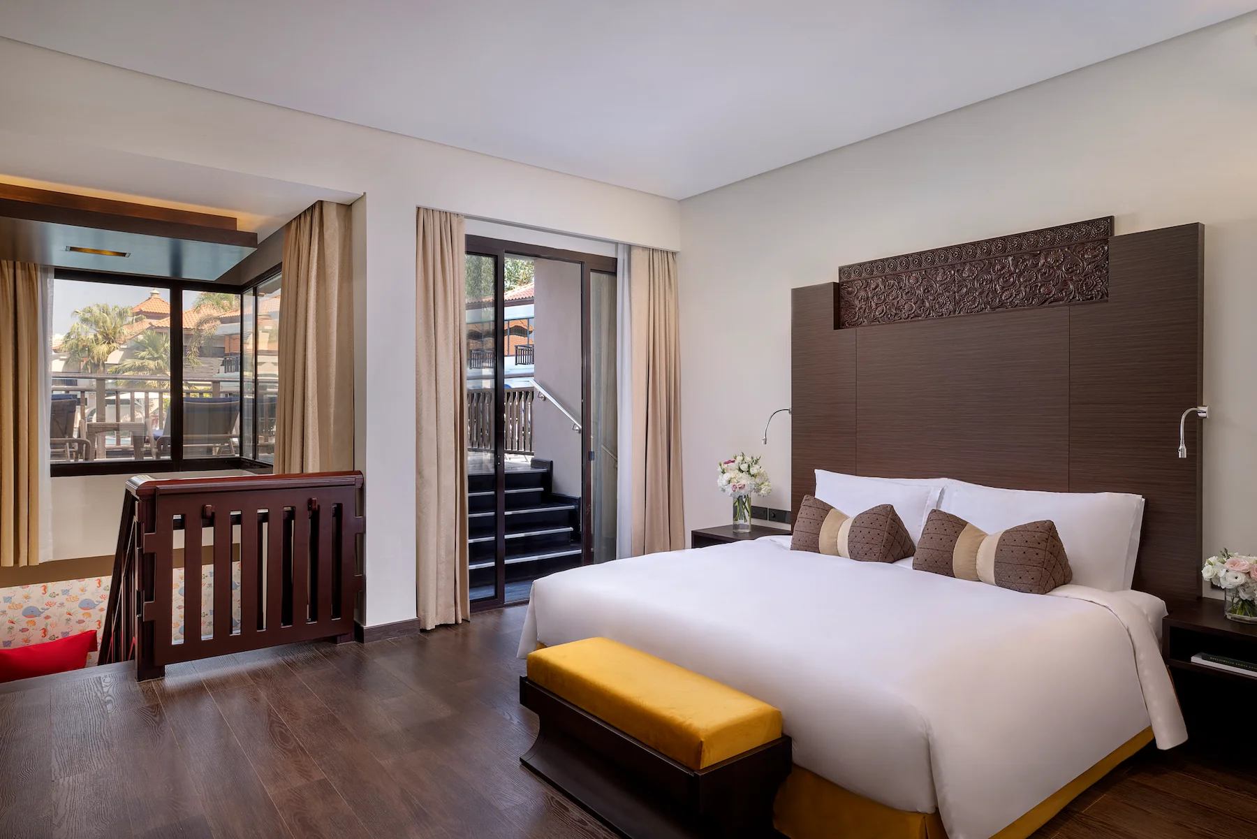 Deluxe Family Lagoon Access Room bedroom at Anantara The Palm Dubai with comfortable beds and family-friendly design