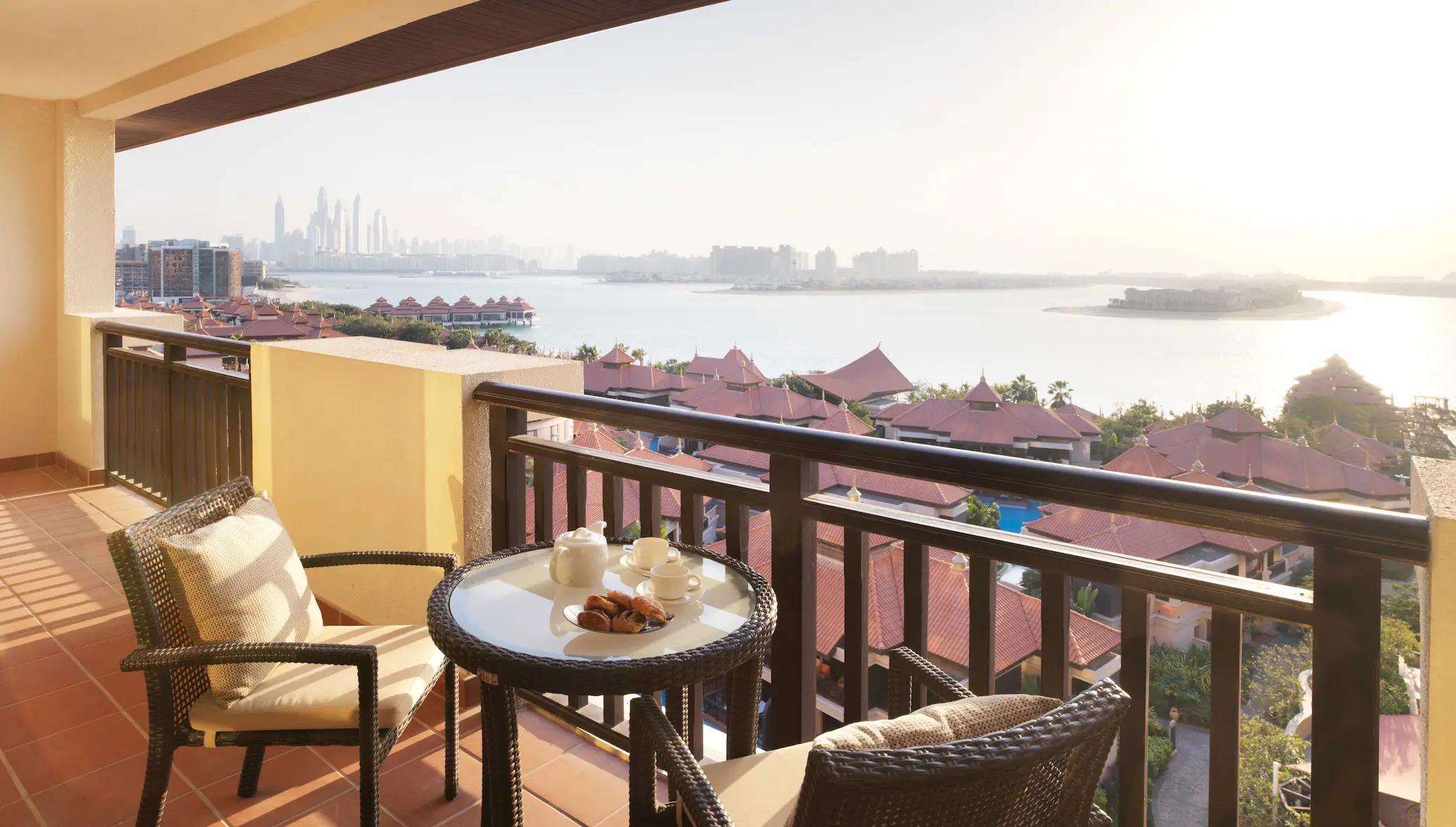 One-Bedroom Apartment balcony at Anantara The Palm Dubai with Palm Jumeirah views and outdoor seating