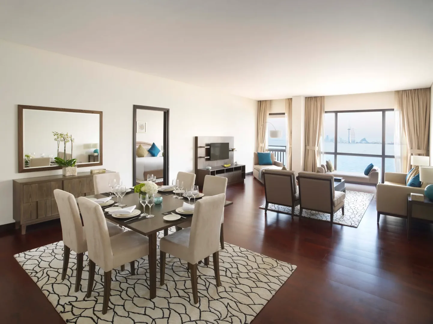 One-Bedroom Apartment living and dining area at Anantara The Palm Dubai with modern furnishings and spacious layout