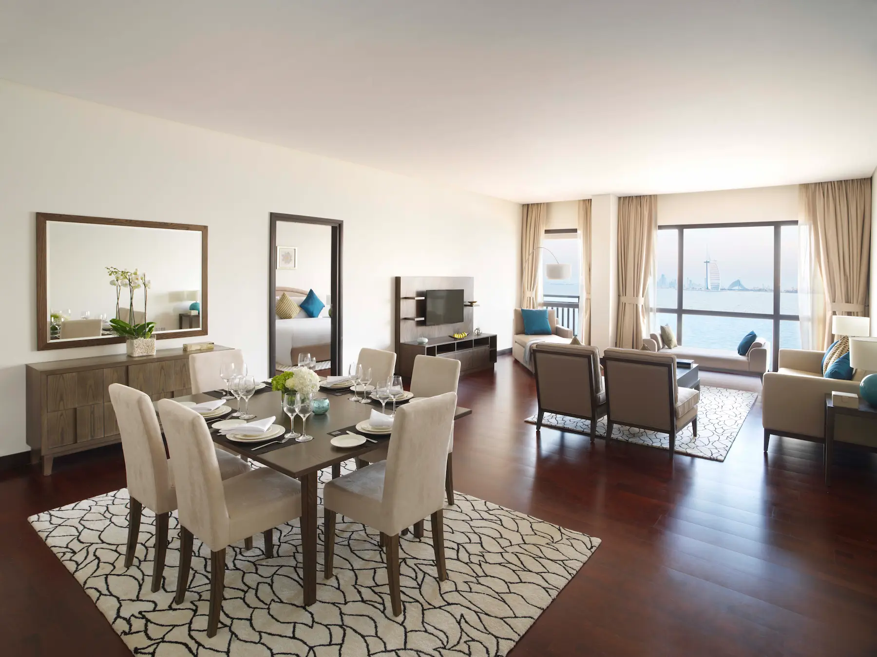 One-Bedroom Apartment living and dining area at Anantara The Palm Dubai with modern furnishings and spacious layout