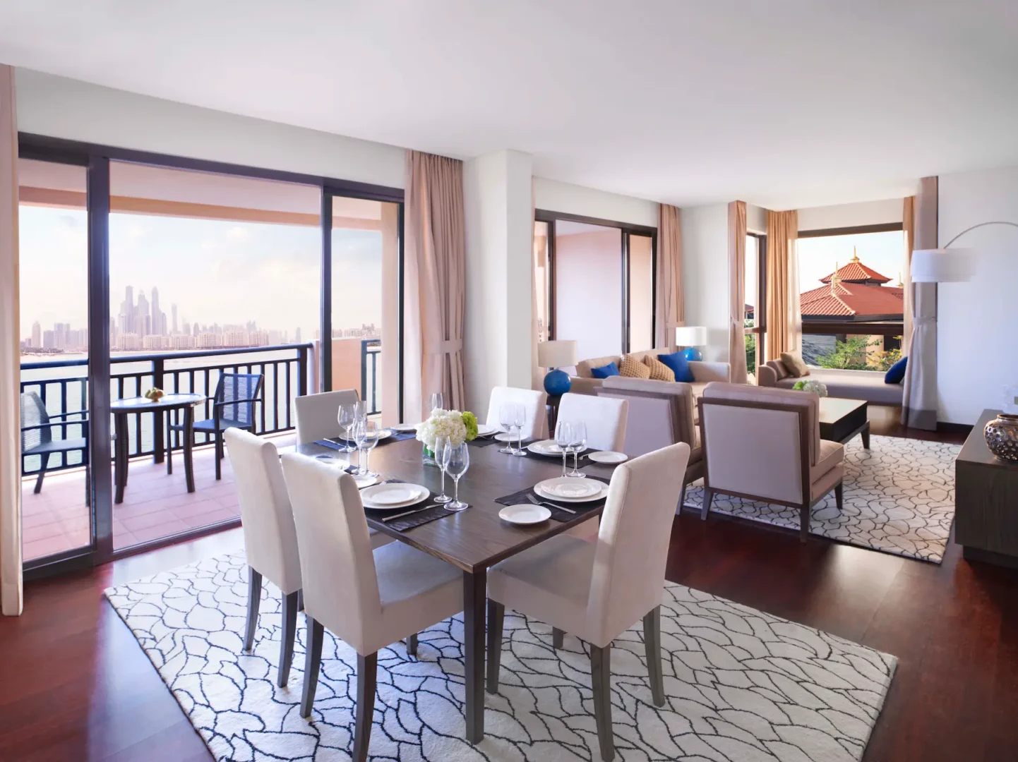 Two-Bedroom Apartment living and dining area with balcony at Anantara The Palm Dubai featuring spacious interiors and natural light