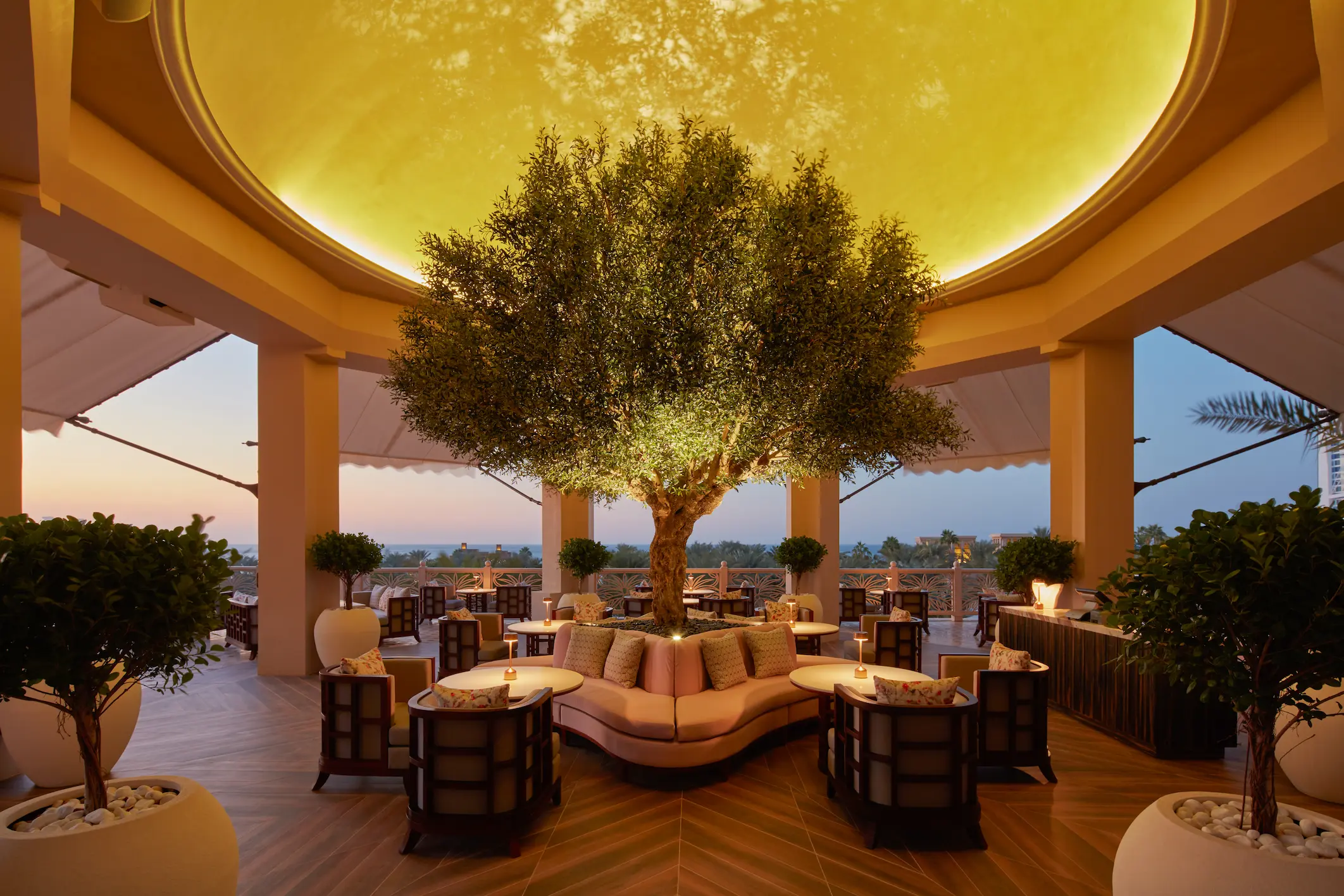 interiors of bar buci at jumeirah al qasr showcasing vintage-inspired design, elegant mixology bar and warm ambient lighting