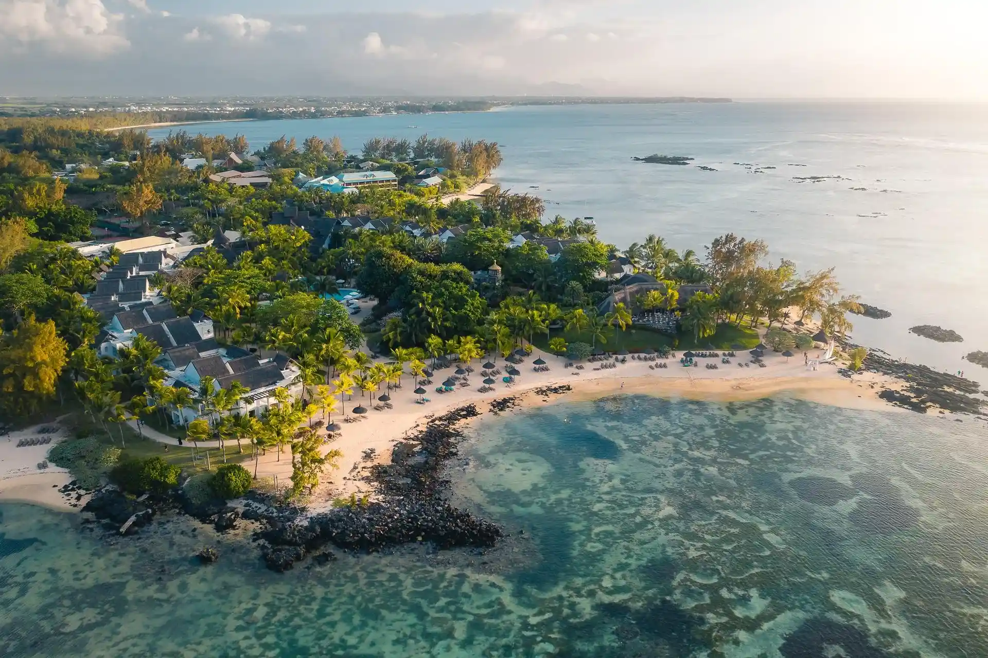 aerial view of le cannonier mauritius with turquoise waters sandy beaches and lush greenery