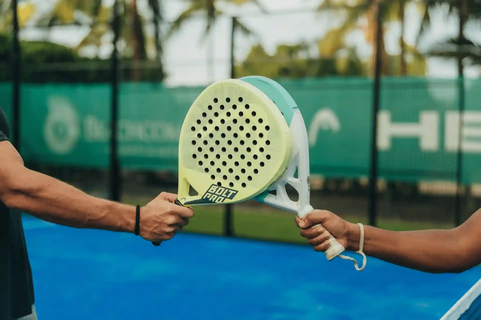 people playing padel on outdoor courts at cannonier mauritius resort