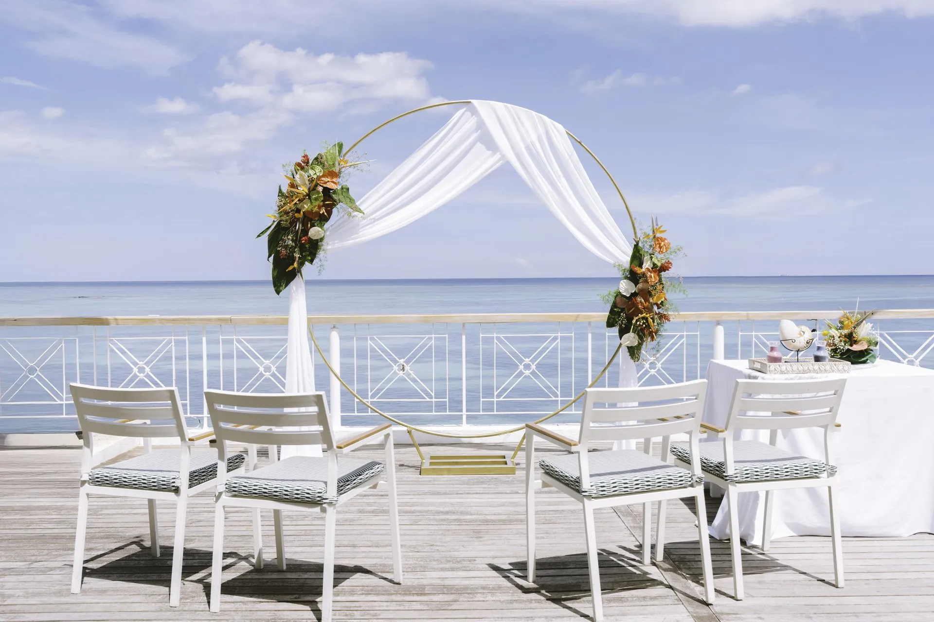 cannonier mauritius wedding set up with beachfront decorations and tropical floral arrangements