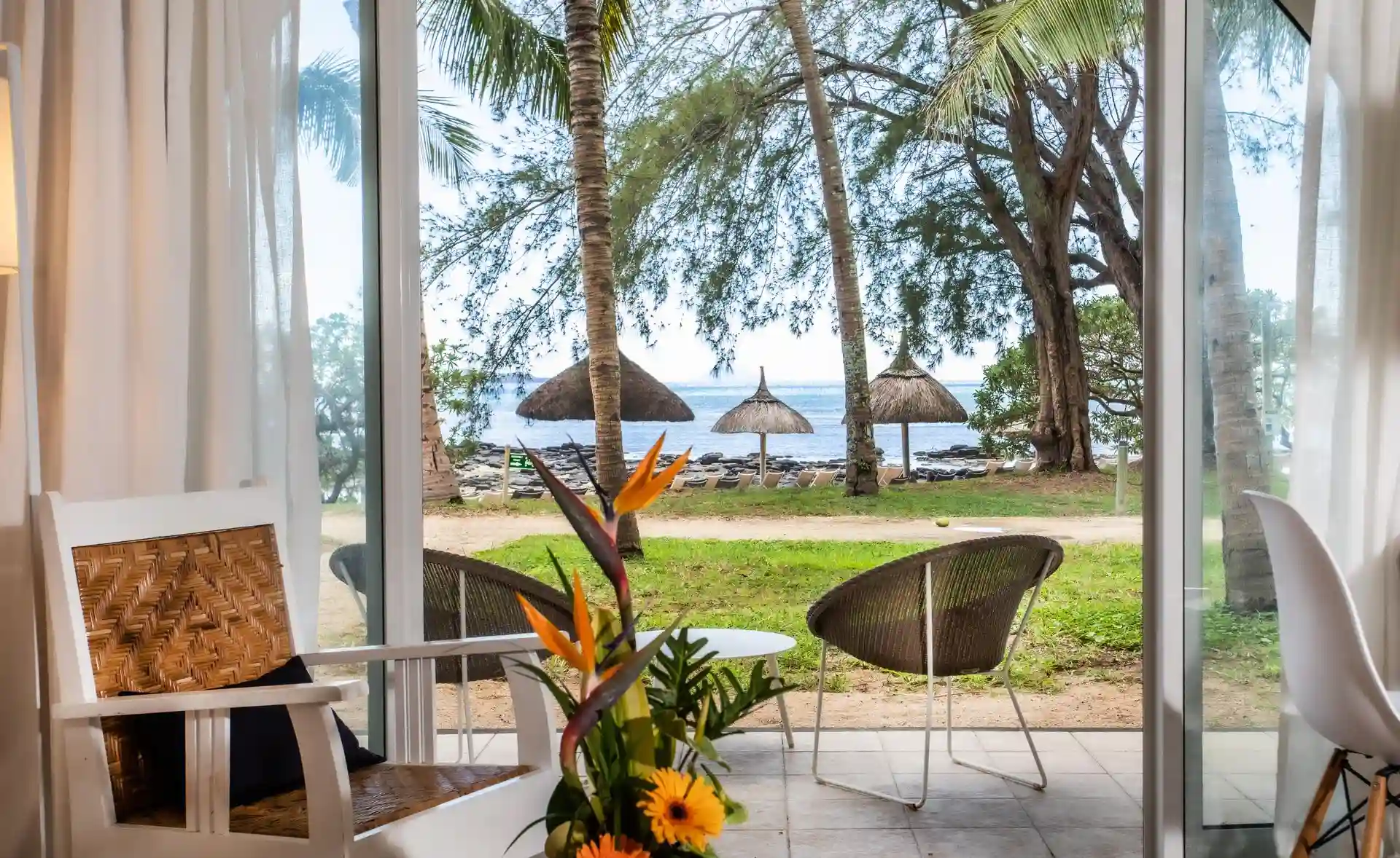 "garden view from standard room at canonnier mauritius with lush tropical greenery