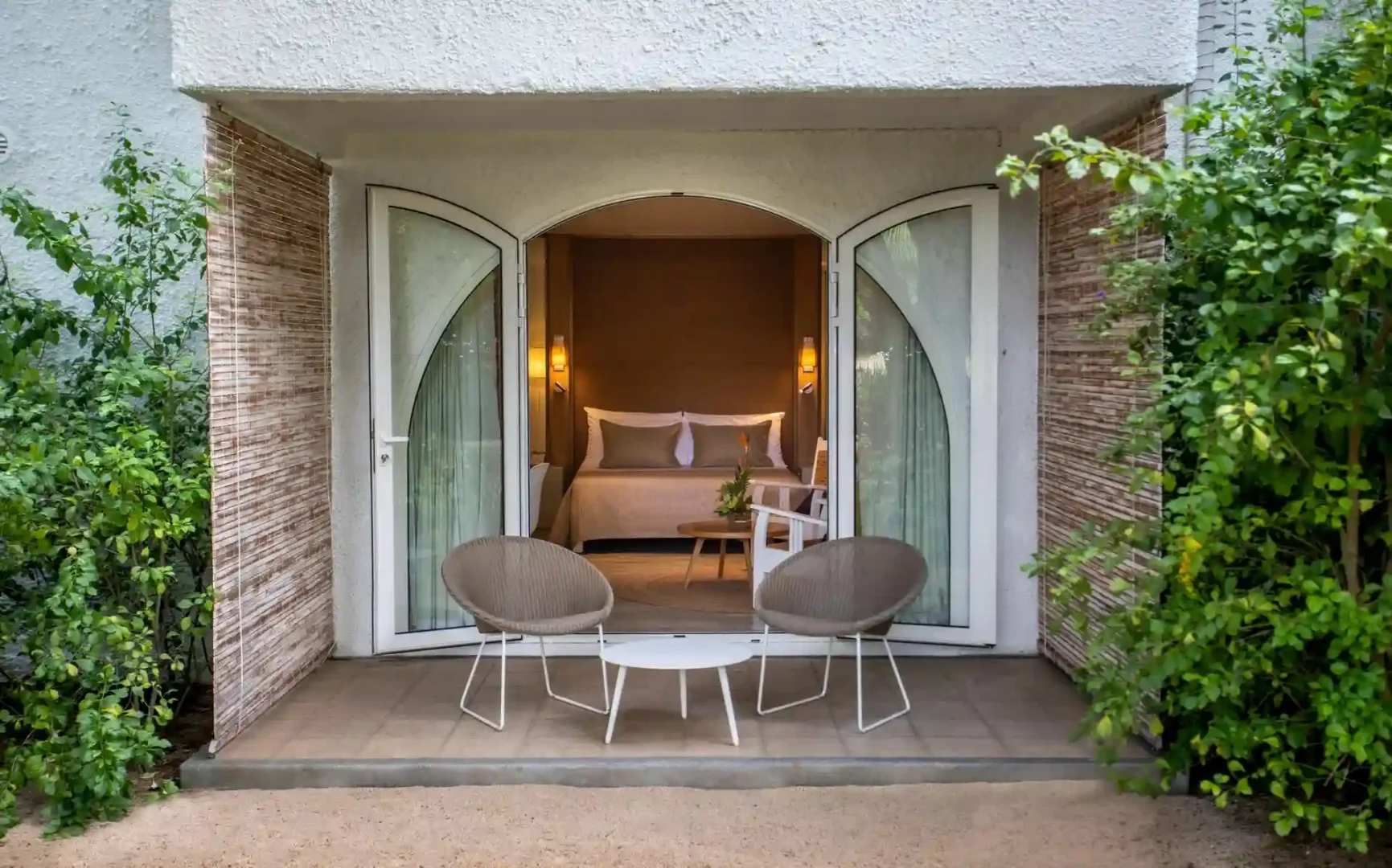 "exterior of standard room at canonnier mauritius showing private terrace and tropical surroundings
