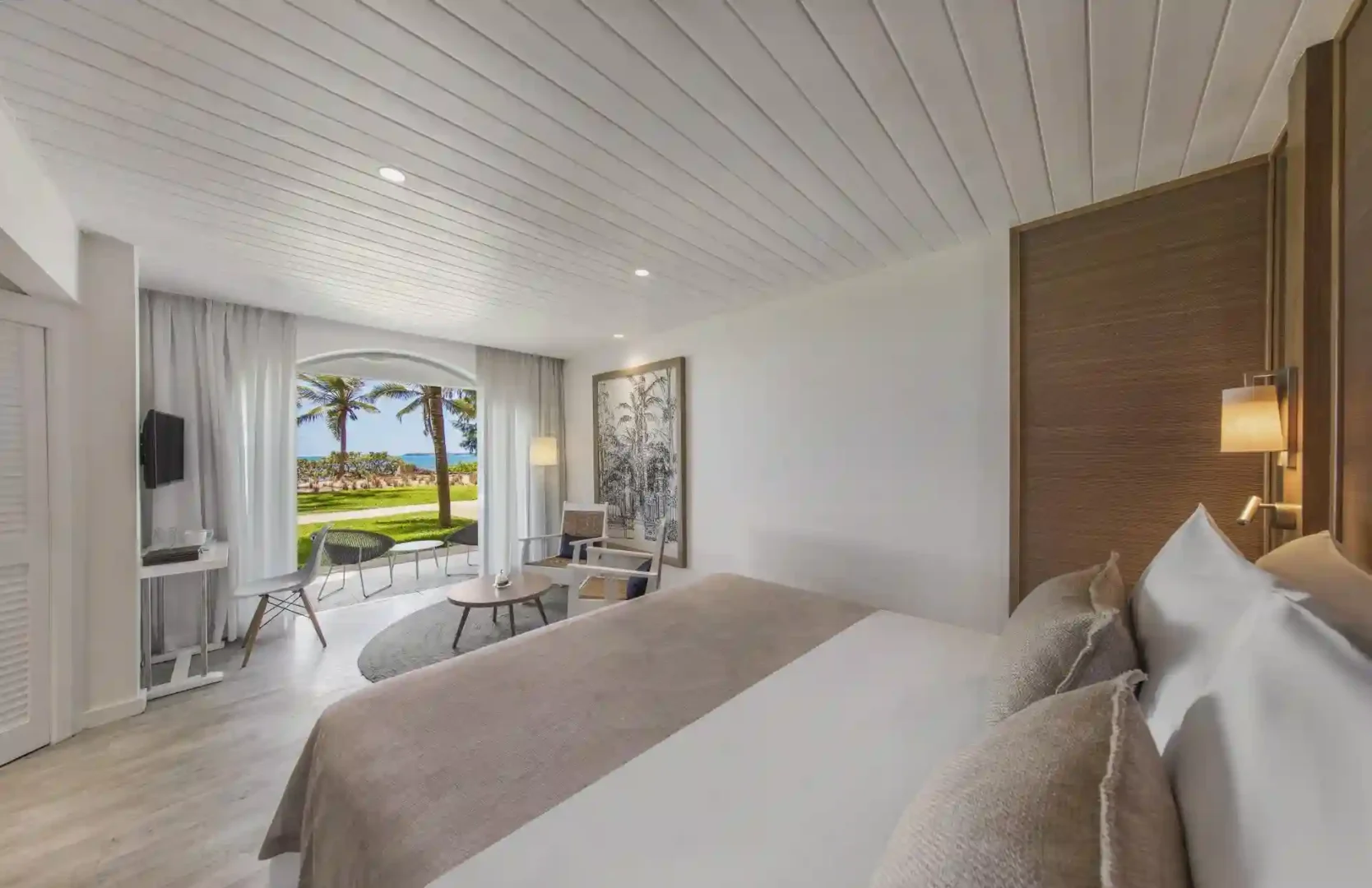 sea view from standard sea-facing room at canonnier mauritius with turquoise waters and sandy beach