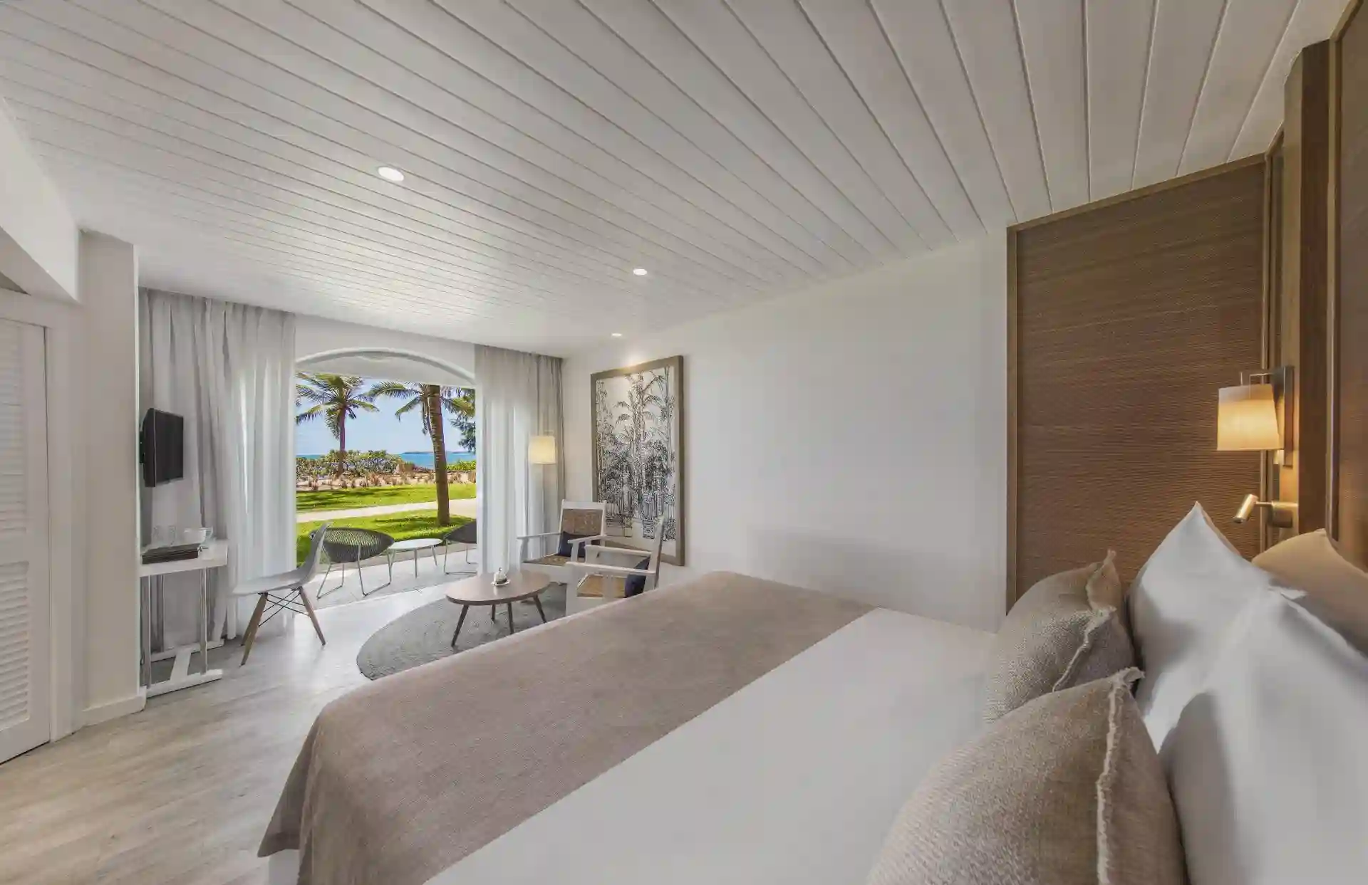 sea view from standard sea-facing room at canonnier mauritius with turquoise waters and sandy beach
