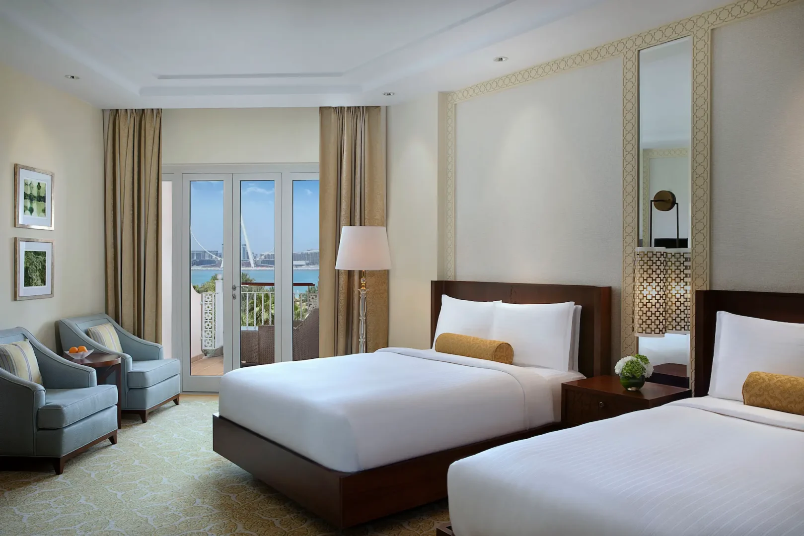 club ocean view twin room at the ritz-carlton dubai jbr luxury beachfront hotel in dubai marina featuring private balcony with arabian gulf views and elegant interiors
