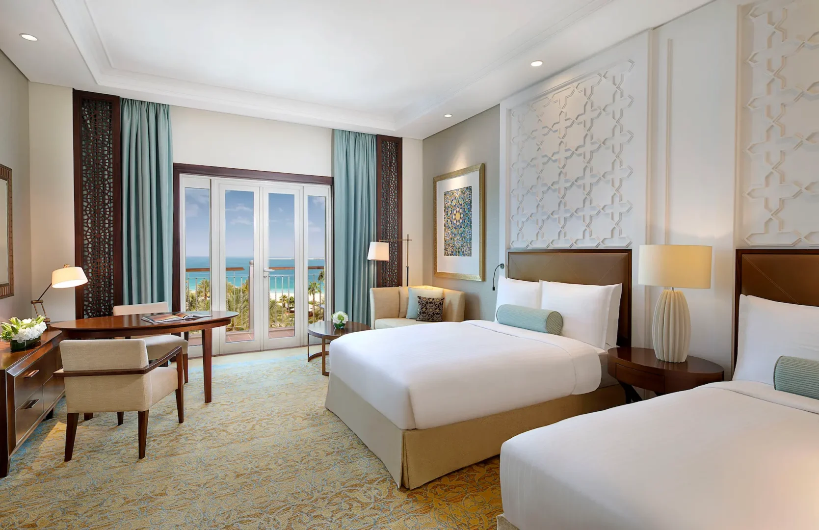 deluxe ocean view twin room at the ritz-carlton dubai jbr luxury beachfront hotel in dubai marina featuring private balcony with arabian gulf views and stylish contemporary interiors