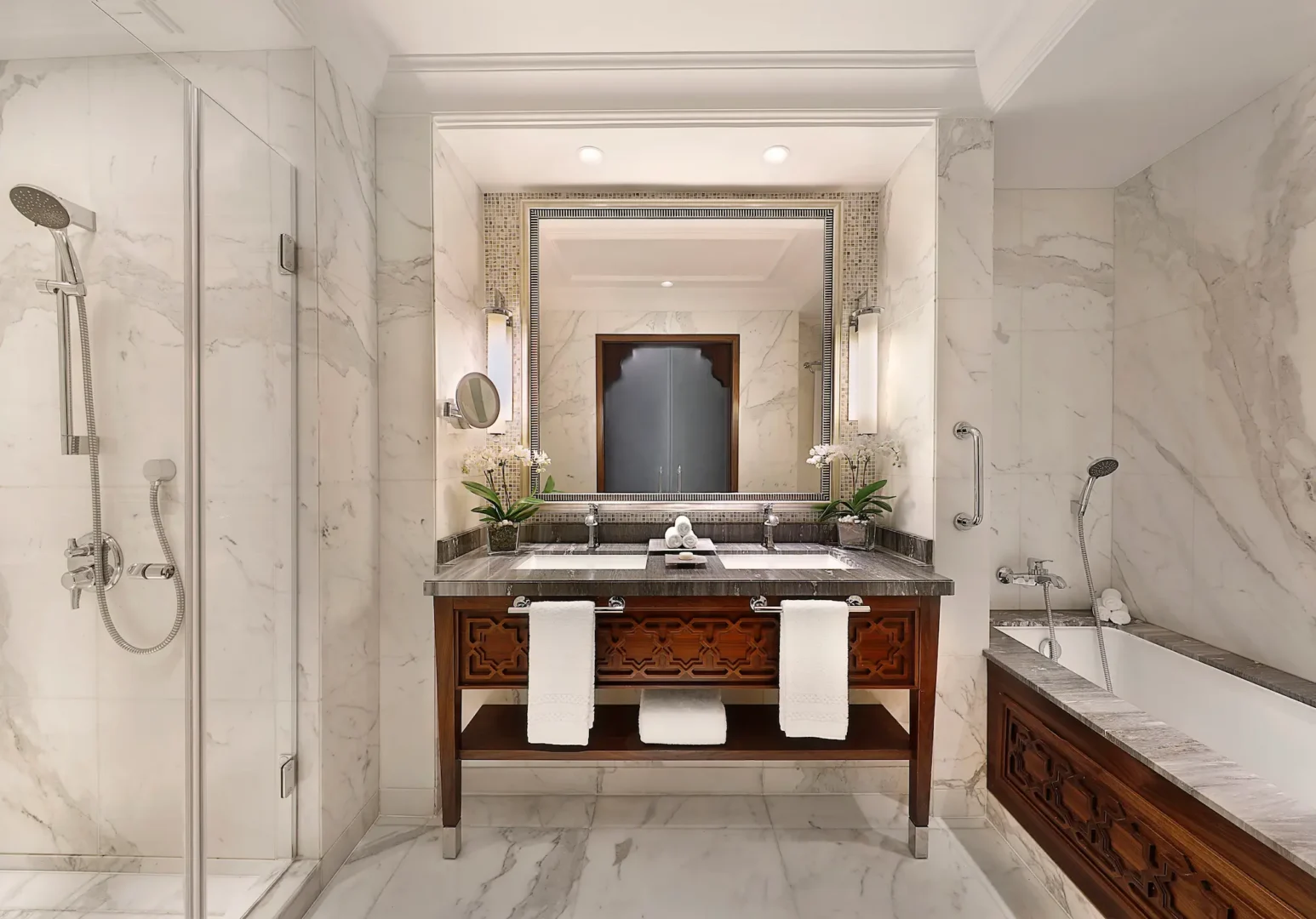 deluxe room bathroom at the ritz-carlton dubai jbr featuring marble finishes deep soaking bathtub walk in shower and luxury amenities in dubai marina.