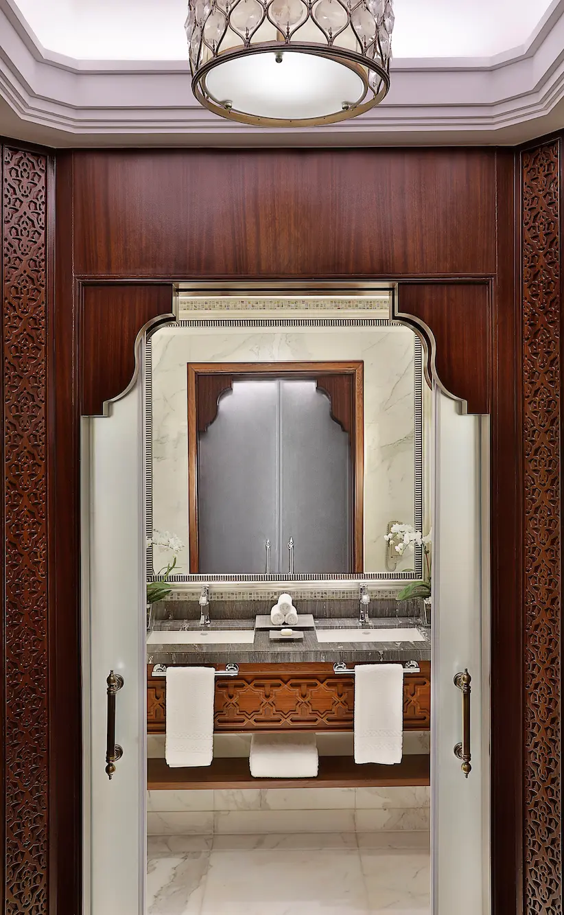 marble bathroom in deluxe room at the ritz-carlton dubai jbr with deep soaking bathtub walk in shower and luxury amenities in dubai marina