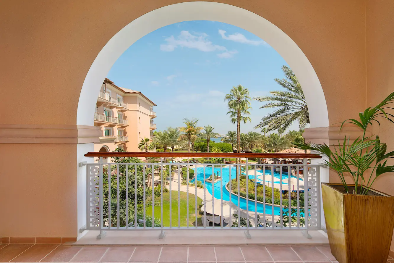 deluxe room garden view at the ritz-carlton dubai jbr luxury beachfront hotel in dubai marina with private balcony overlooking landscaped gardens