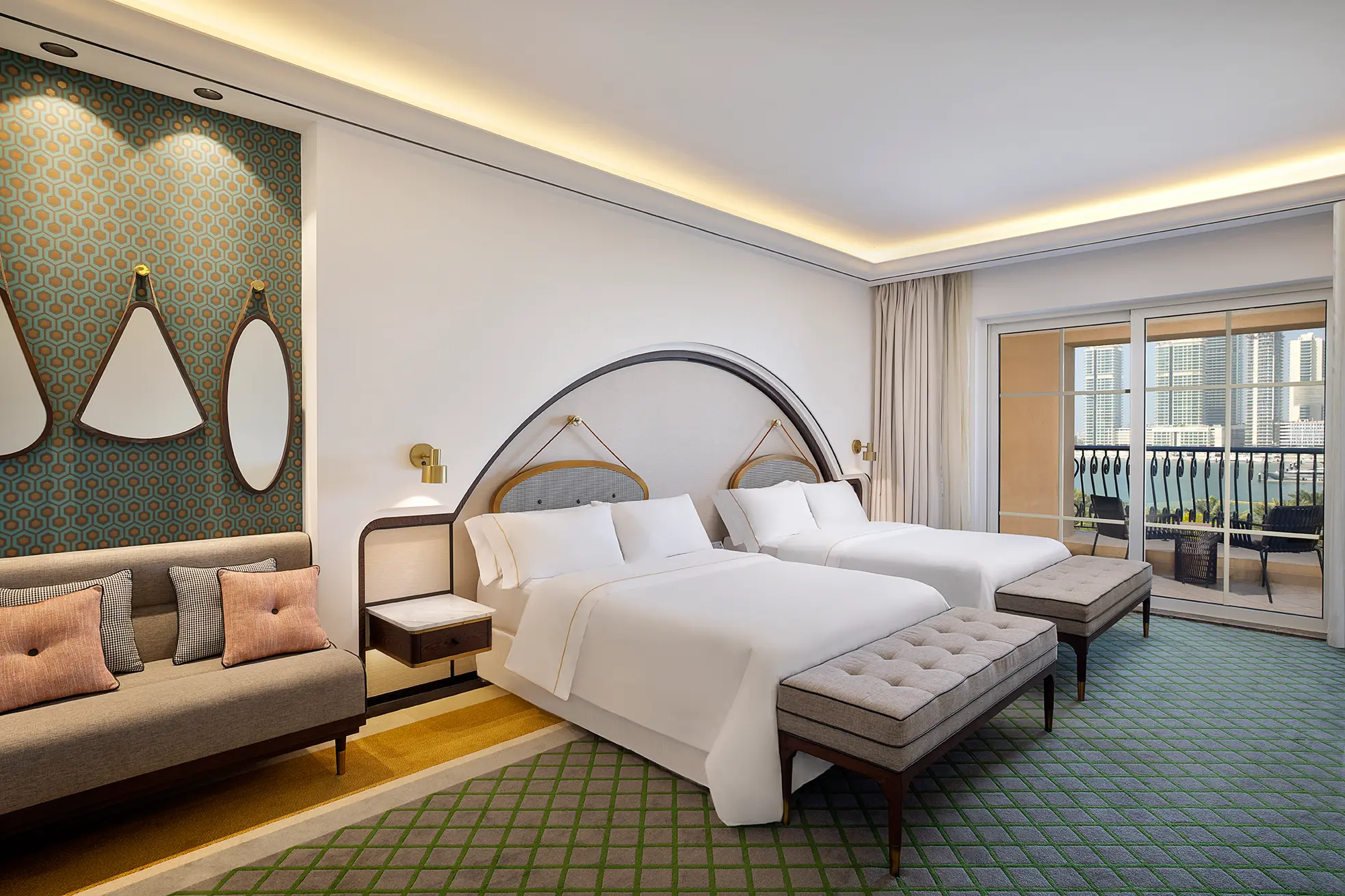 deluxe sea view twin bedroom at the westin dubai mina seyahi with two double beds and floor-to-ceiling windows