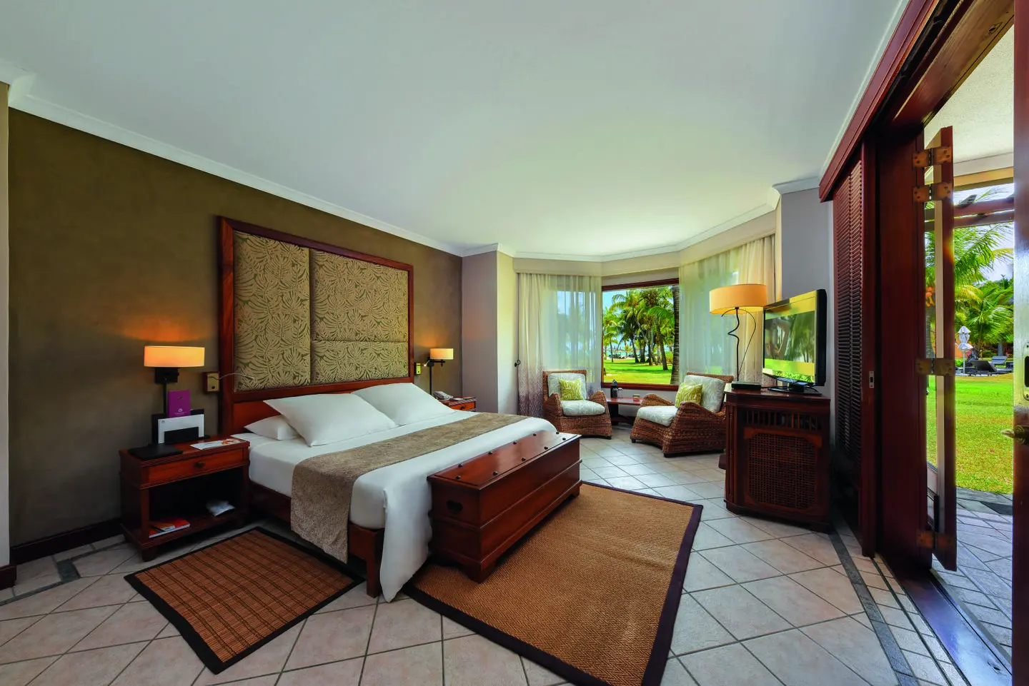 dinarobin beachcomber junior suite ocean view with turquoise lagoon and lush tropical surroundings