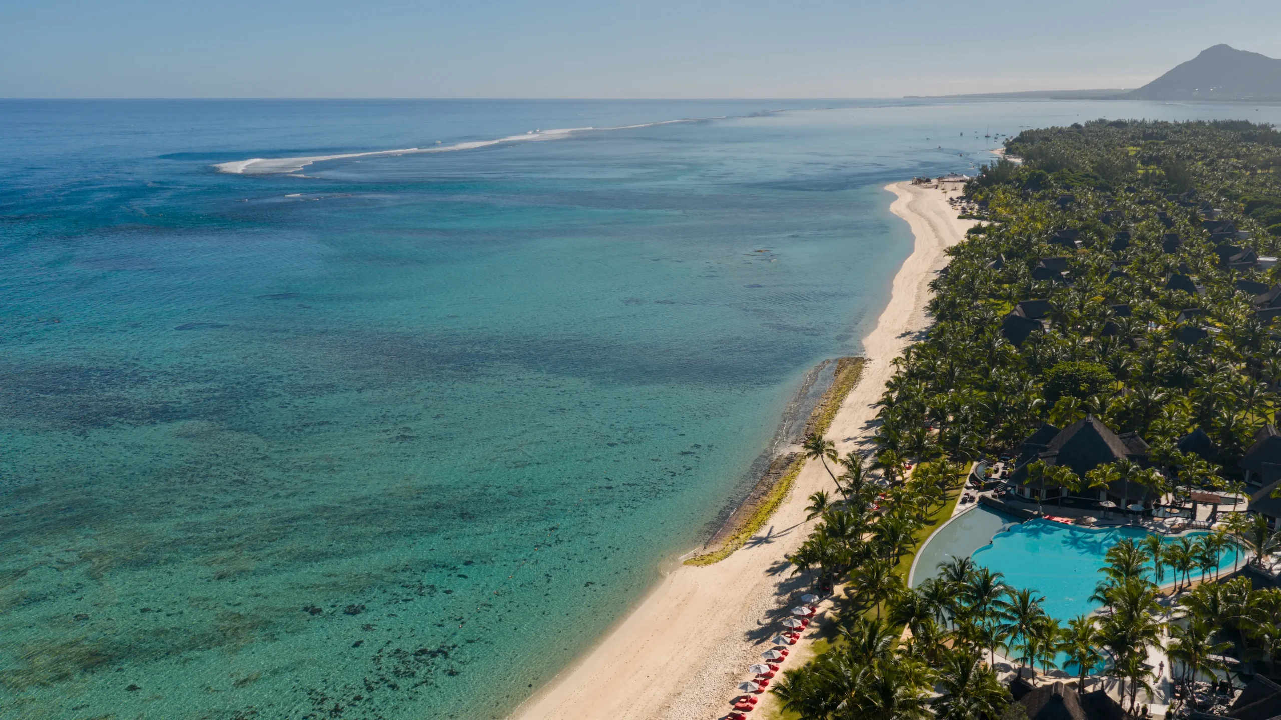 dinarobin beachcomber mauritius aerial view of the surrounding turquoise ocean, tropical coastline and resort landscape