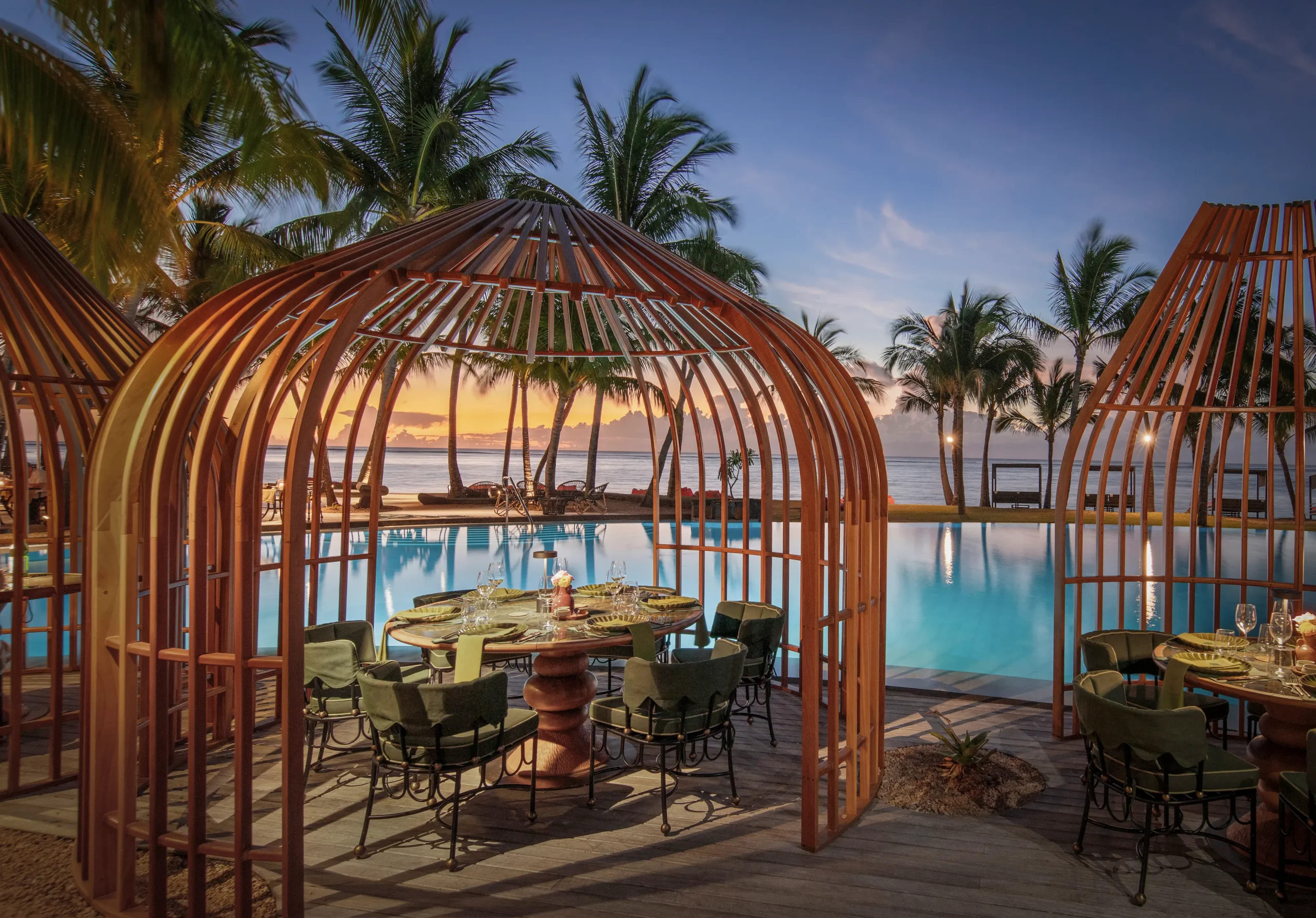 dinarobin beachcomber mauritius ragoli restaurant overlooking the resort pool in an elegant tropical setting