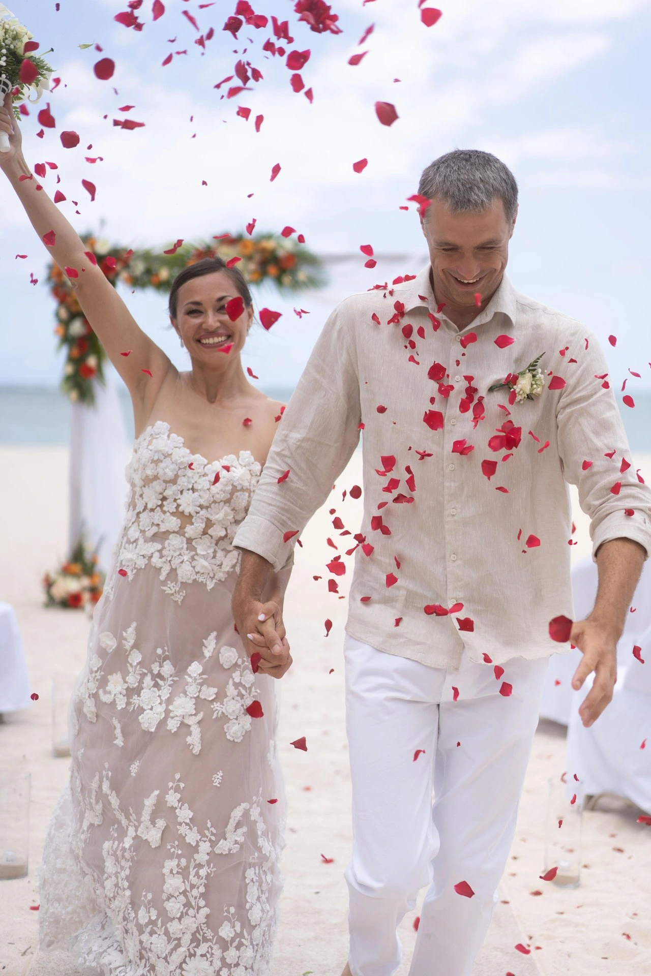 dinarobin mauritius wedding confetti celebration with bride and groom at beachfront resort