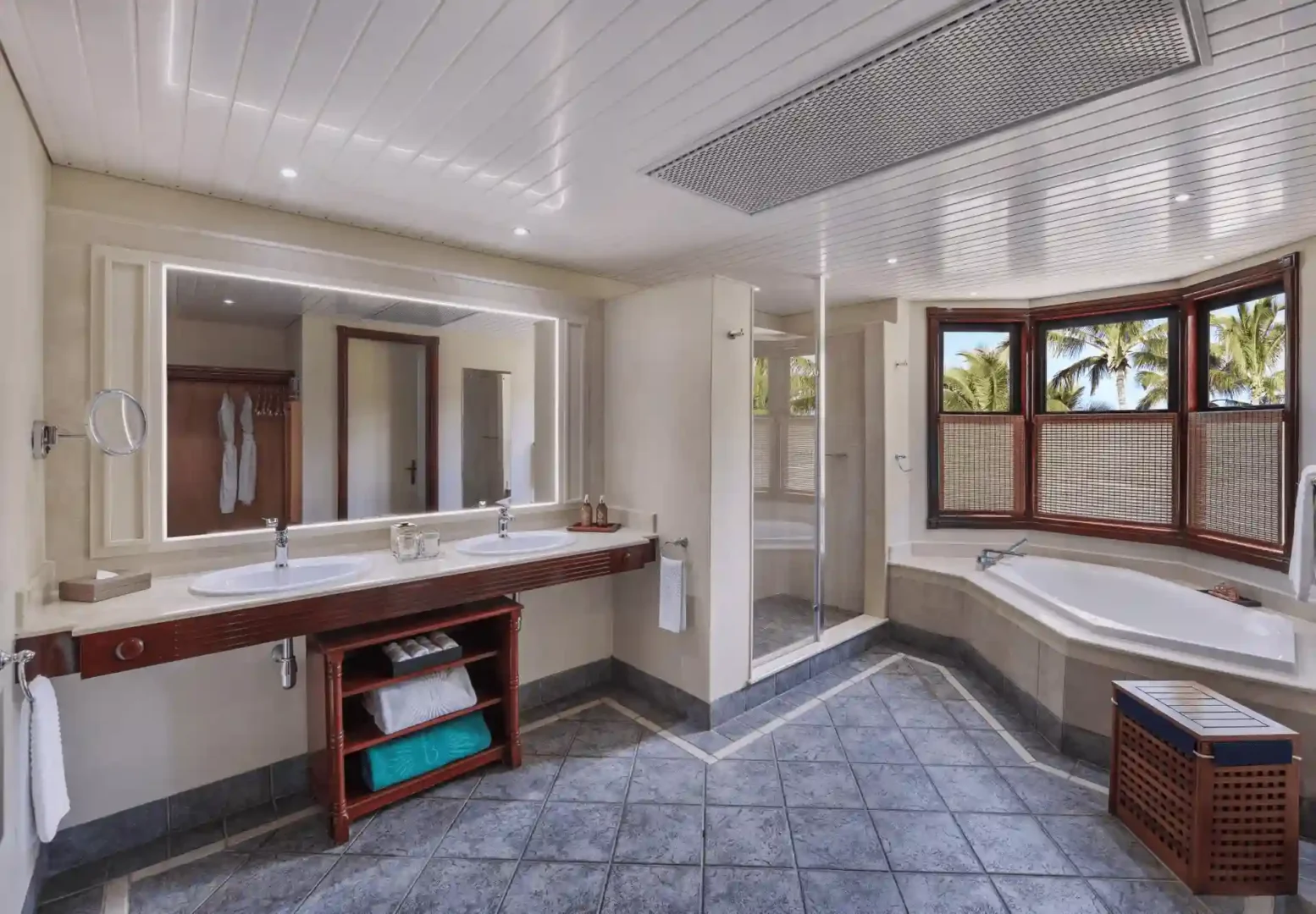 dinarobin suite bathroom double sinks with marble countertop and modern fixtures