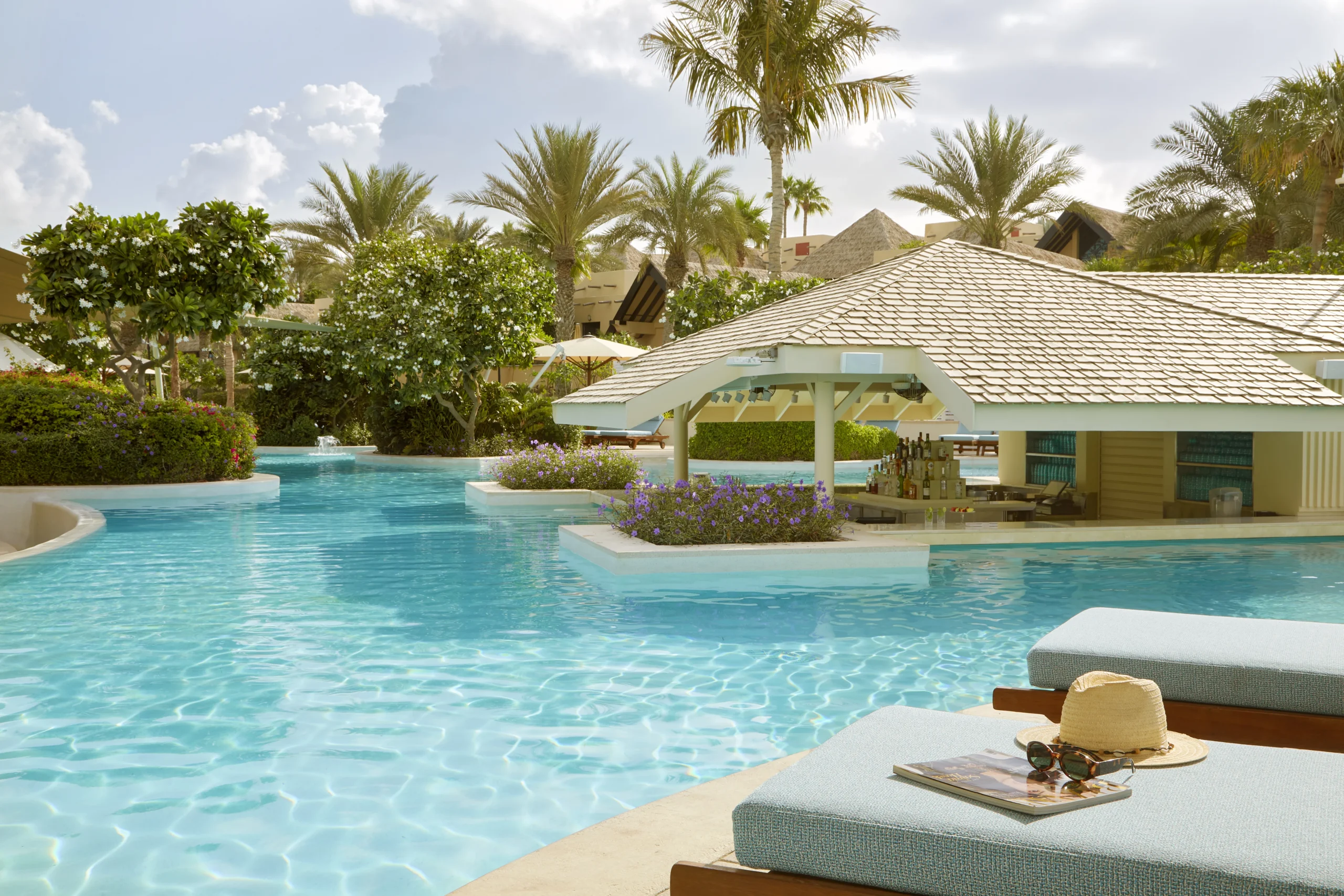 pool bar at executive pool club at Jumeirah Beach Hotel with relaxed outdoor seating, resort-style ambience and arabian gulf views