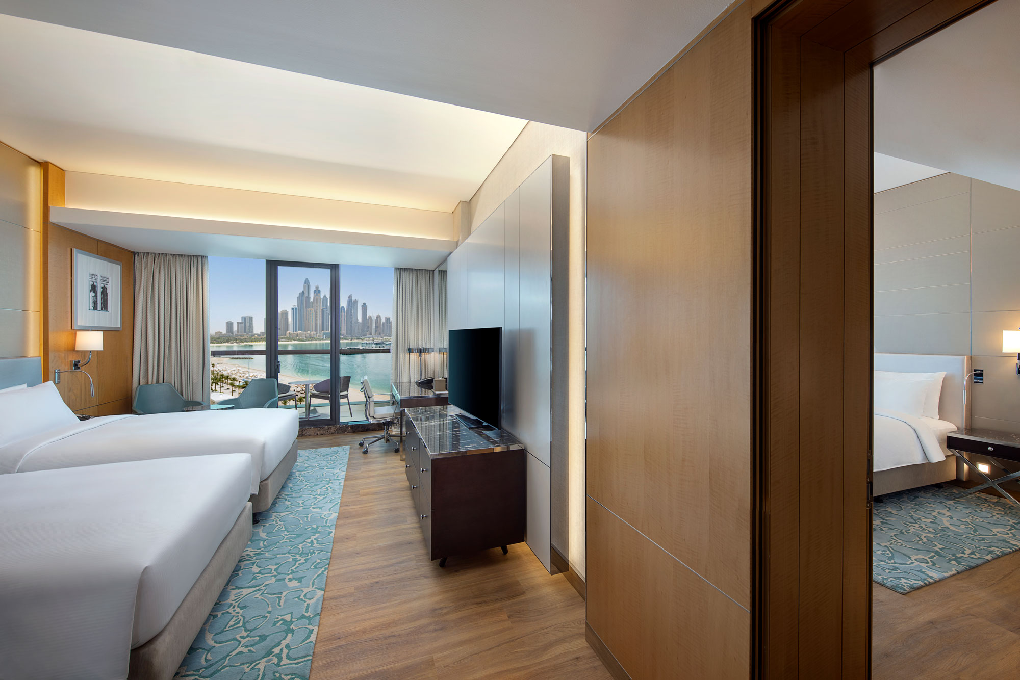 Here’s the alt tag in your preferred lowercase style: family connecting deluxe room with sea view and connecting room at hilton dubai palm jumeirah