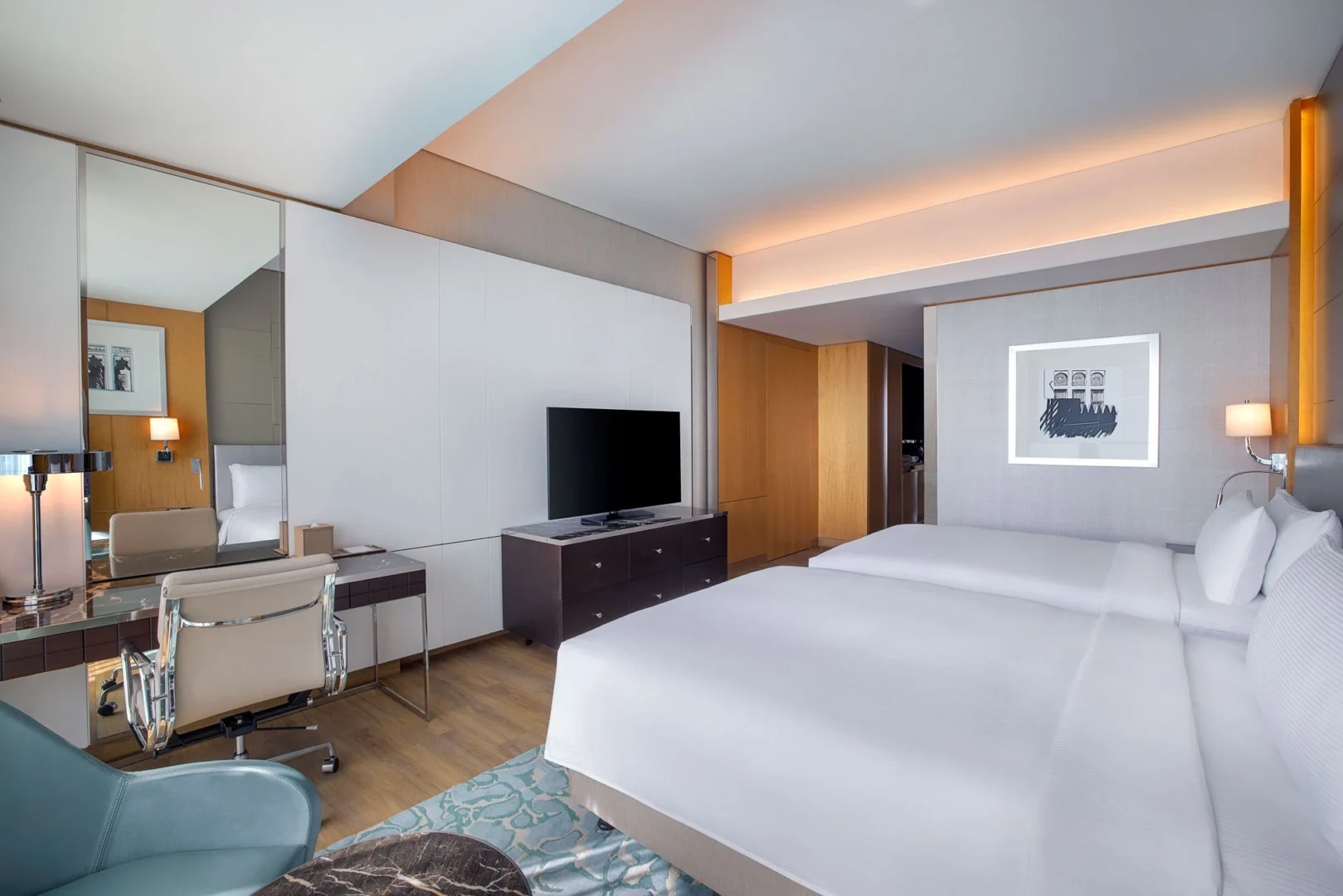 family connecting deluxe room with sea view desk at hilton dubai palm jumeirah