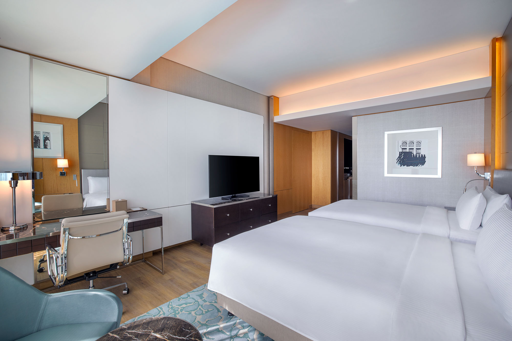 family connecting deluxe room with sea view desk at hilton dubai palm jumeirah