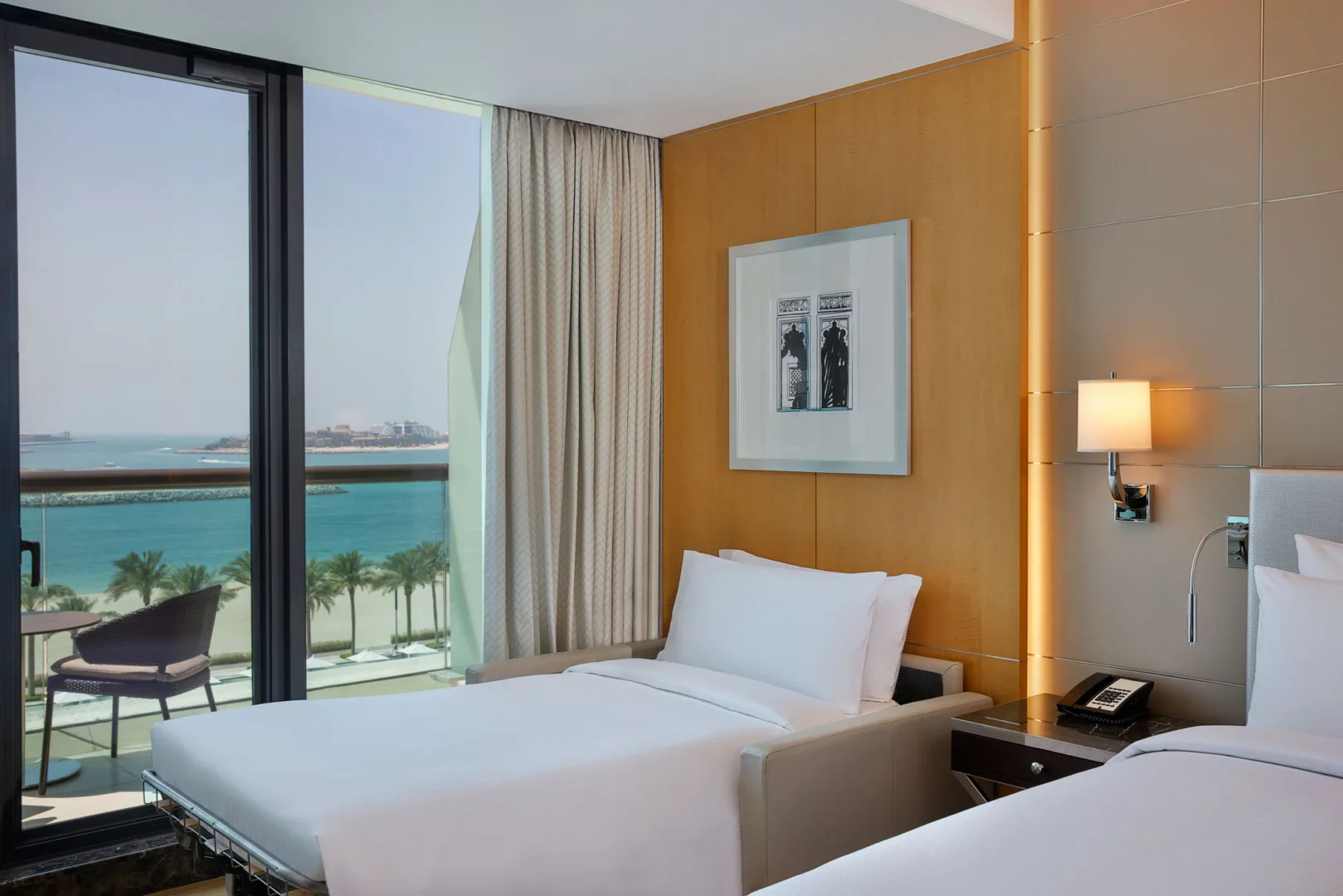 family connecting deluxe room with sea view sofa bed at hilton dubai palm jumeirah