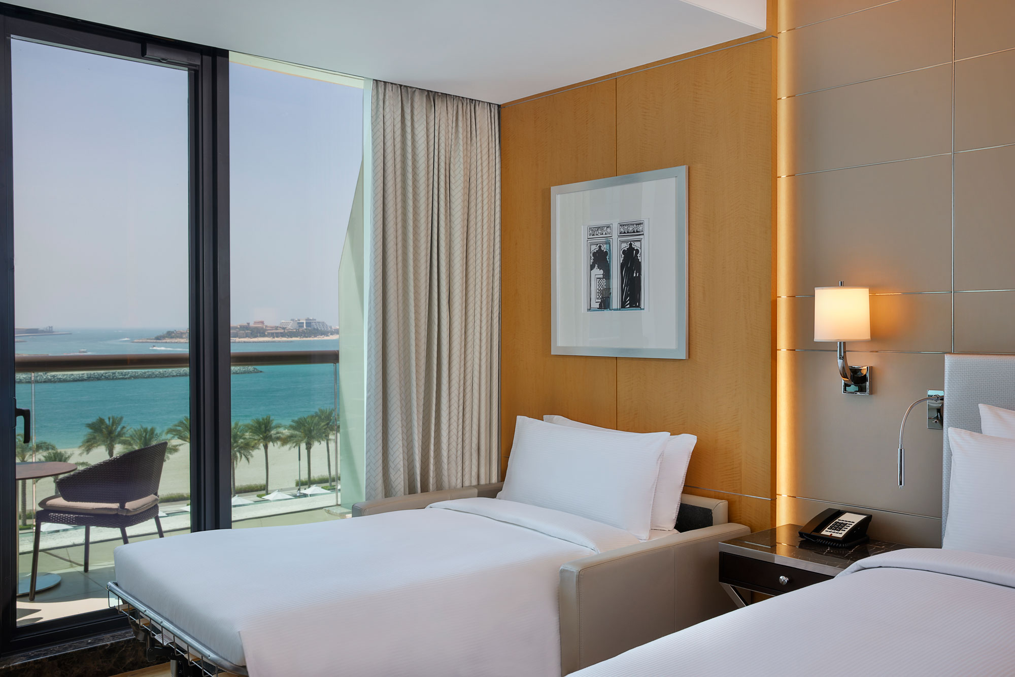 family connecting deluxe room with sea view sofa bed at hilton dubai palm jumeirah