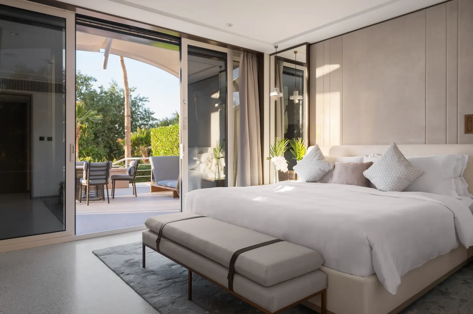 bedroom in family garden suite at Jumeirah Beach Hotel with king bed, modern furnishings and garden views