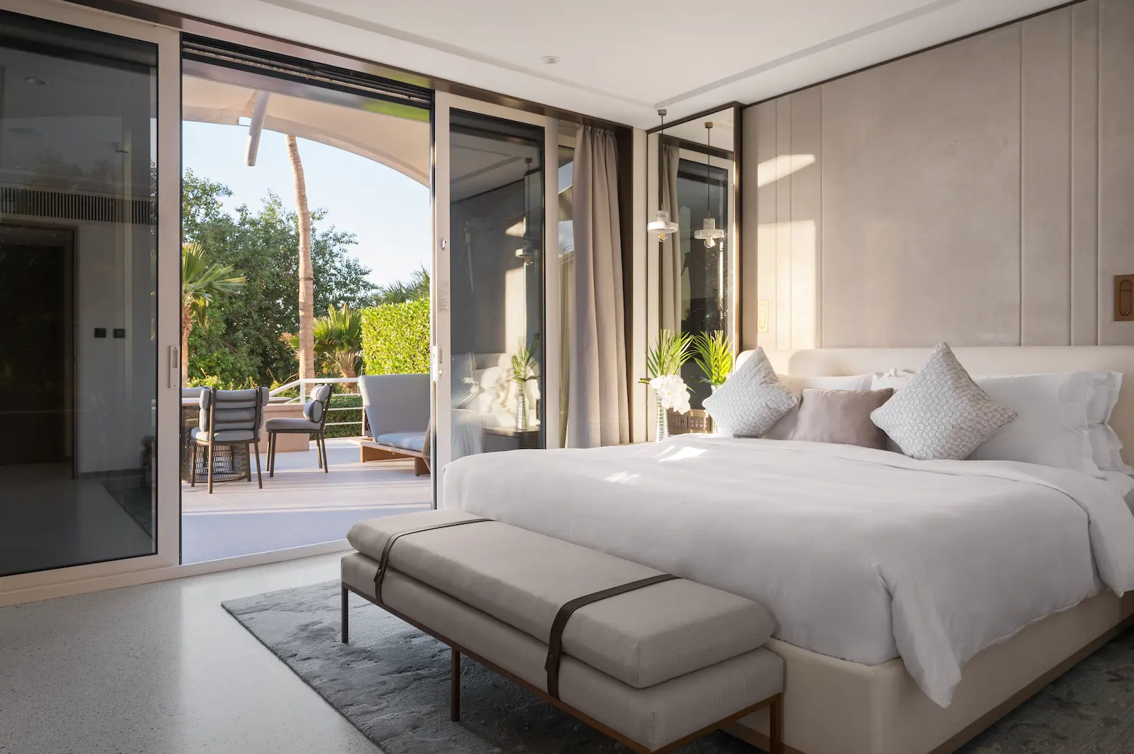bedroom in family garden suite at Jumeirah Beach Hotel with king bed, modern furnishings and garden views