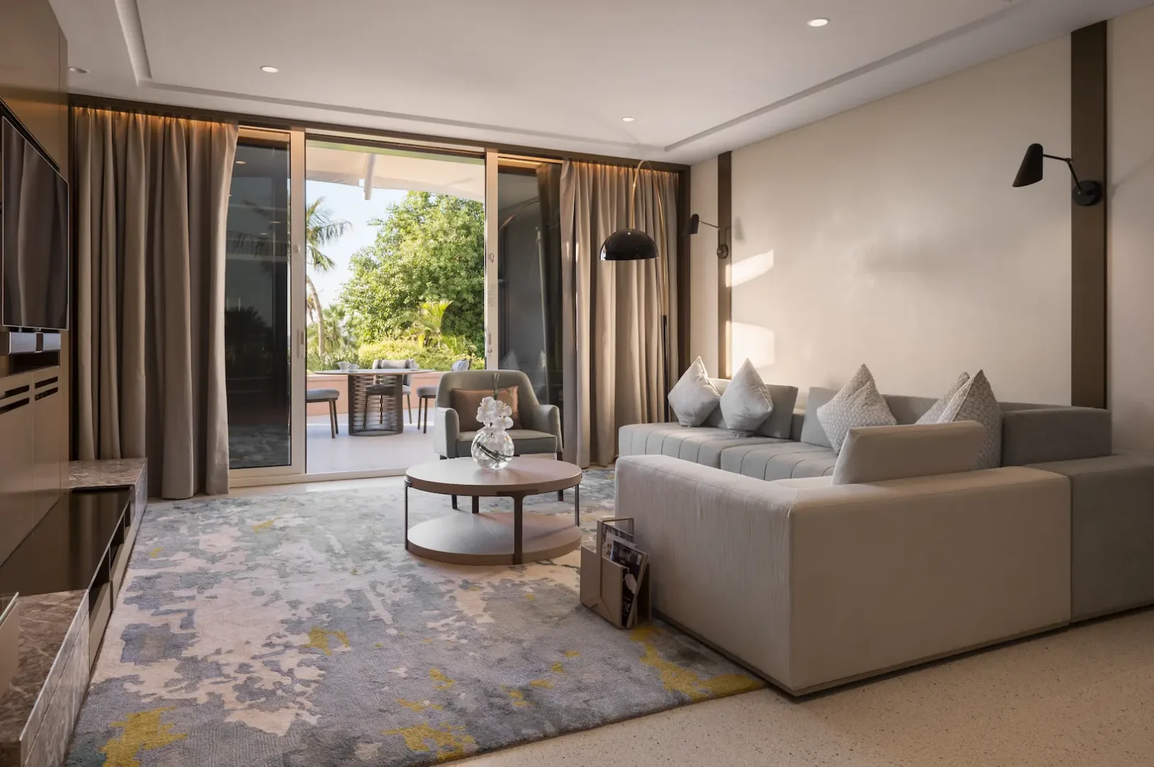 living room in family garden suite at Jumeirah Beach Hotel with spacious seating area, modern décor and private garden access