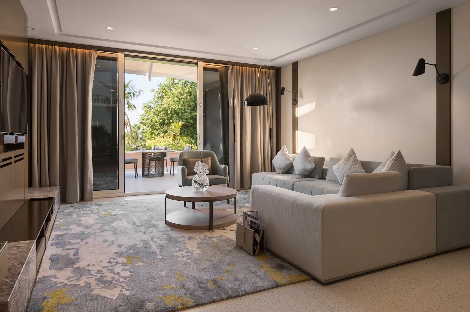 living room in family garden suite at Jumeirah Beach Hotel with spacious seating area, modern décor and private garden access