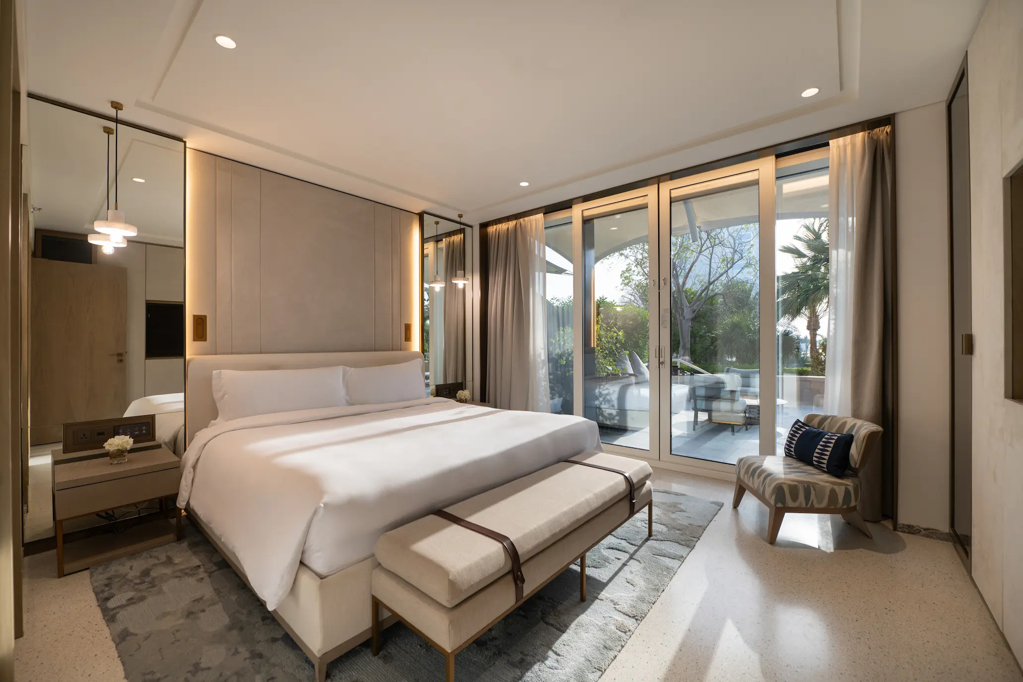master bedroom in family garden suite at Jumeirah Beach Hotel with king bed, modern interiors and garden views